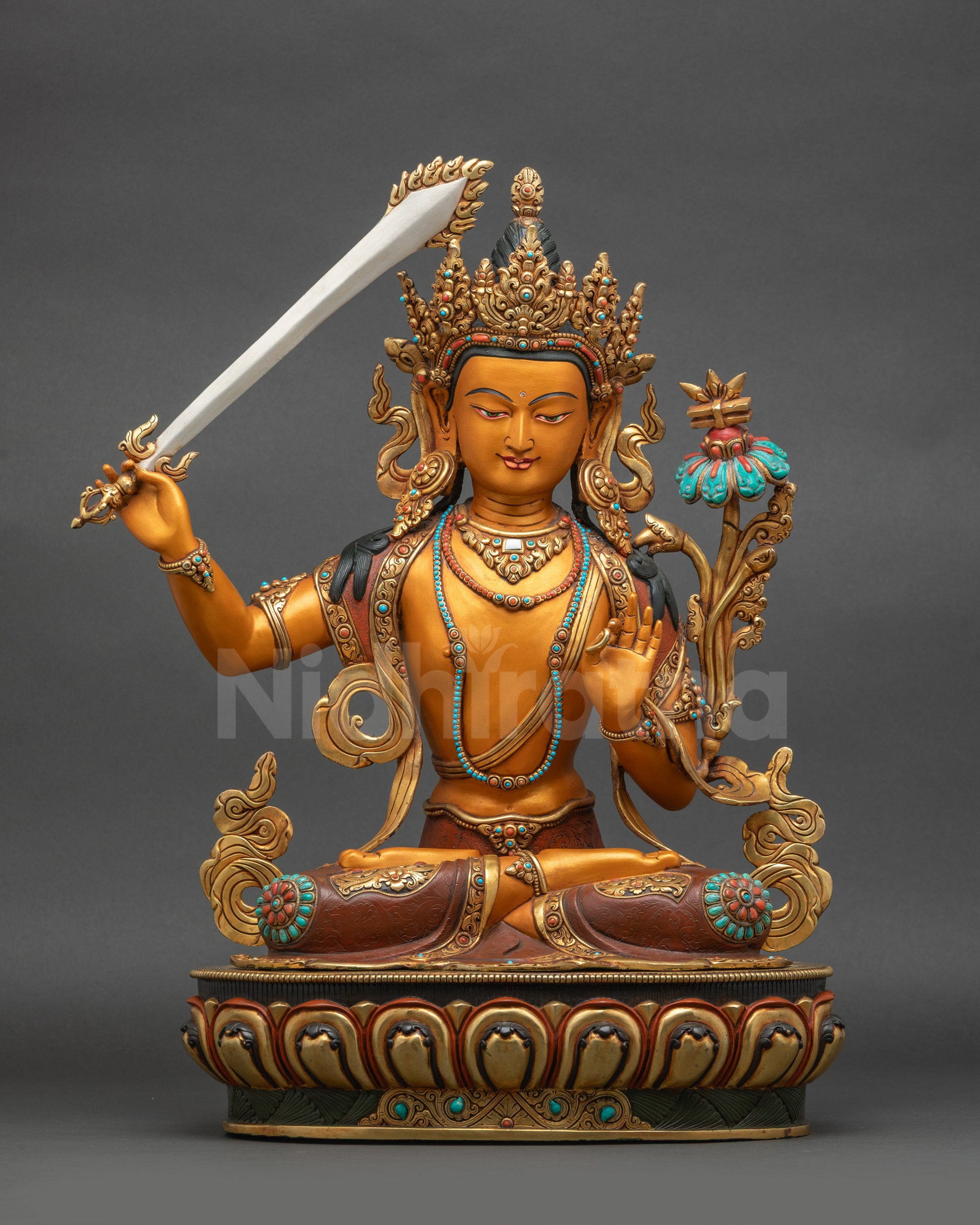 Front view of colourful handpainted Manjushri wisdom deity statue for Buddhist home altar