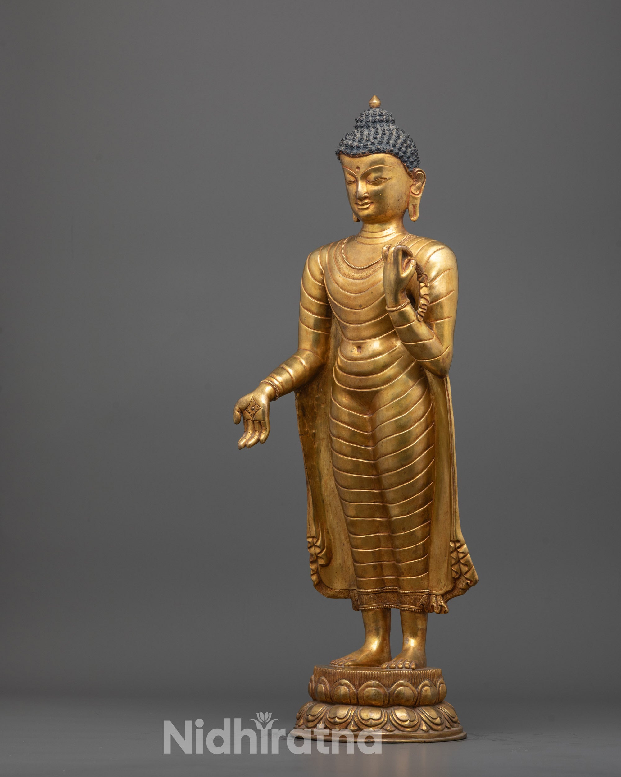 Front view of copper Standing Buddha sculpture with 24k gold plating standing
