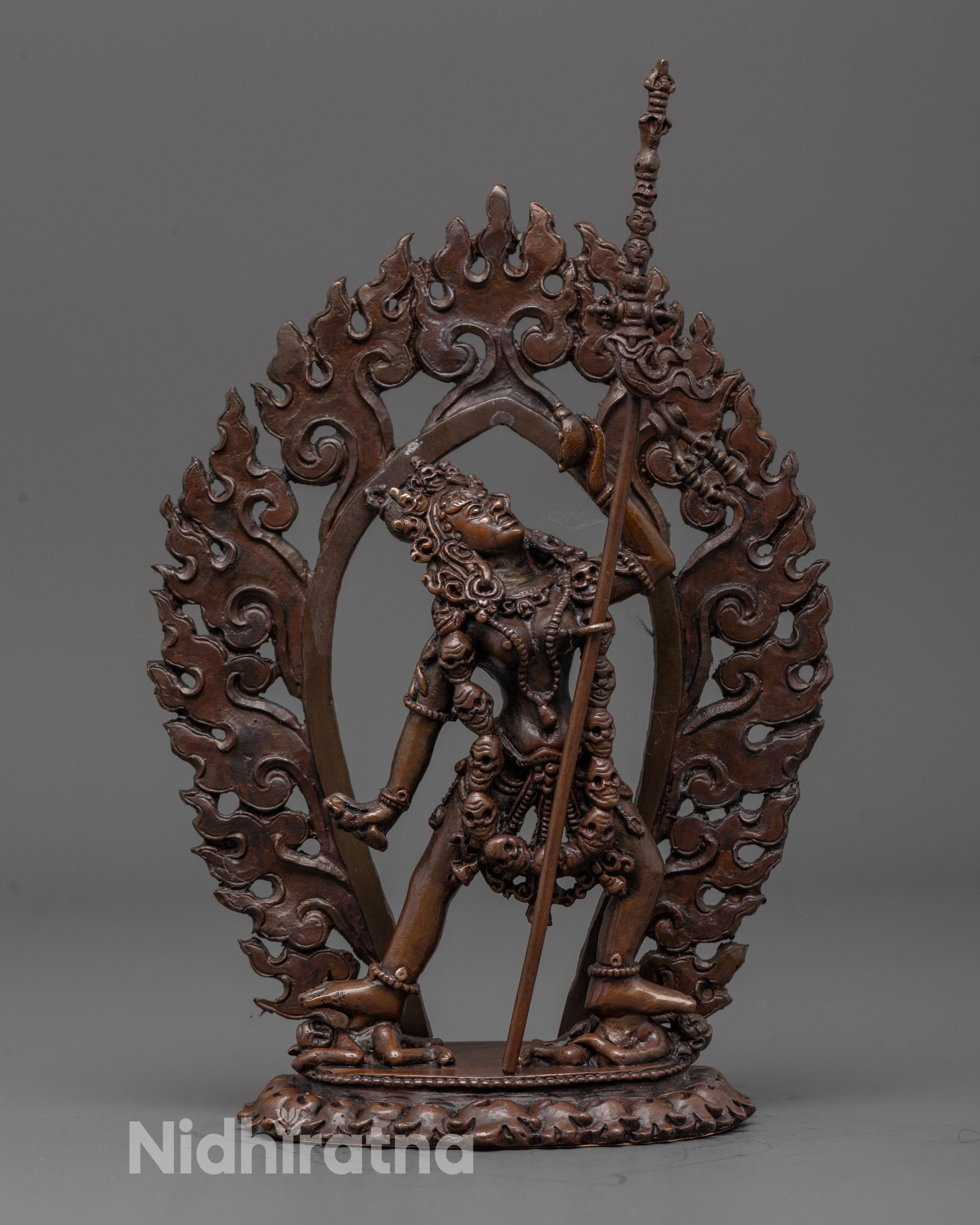 Front view of fierce Vajrayogini oxidized statue with khatvanga trident and detailed robes