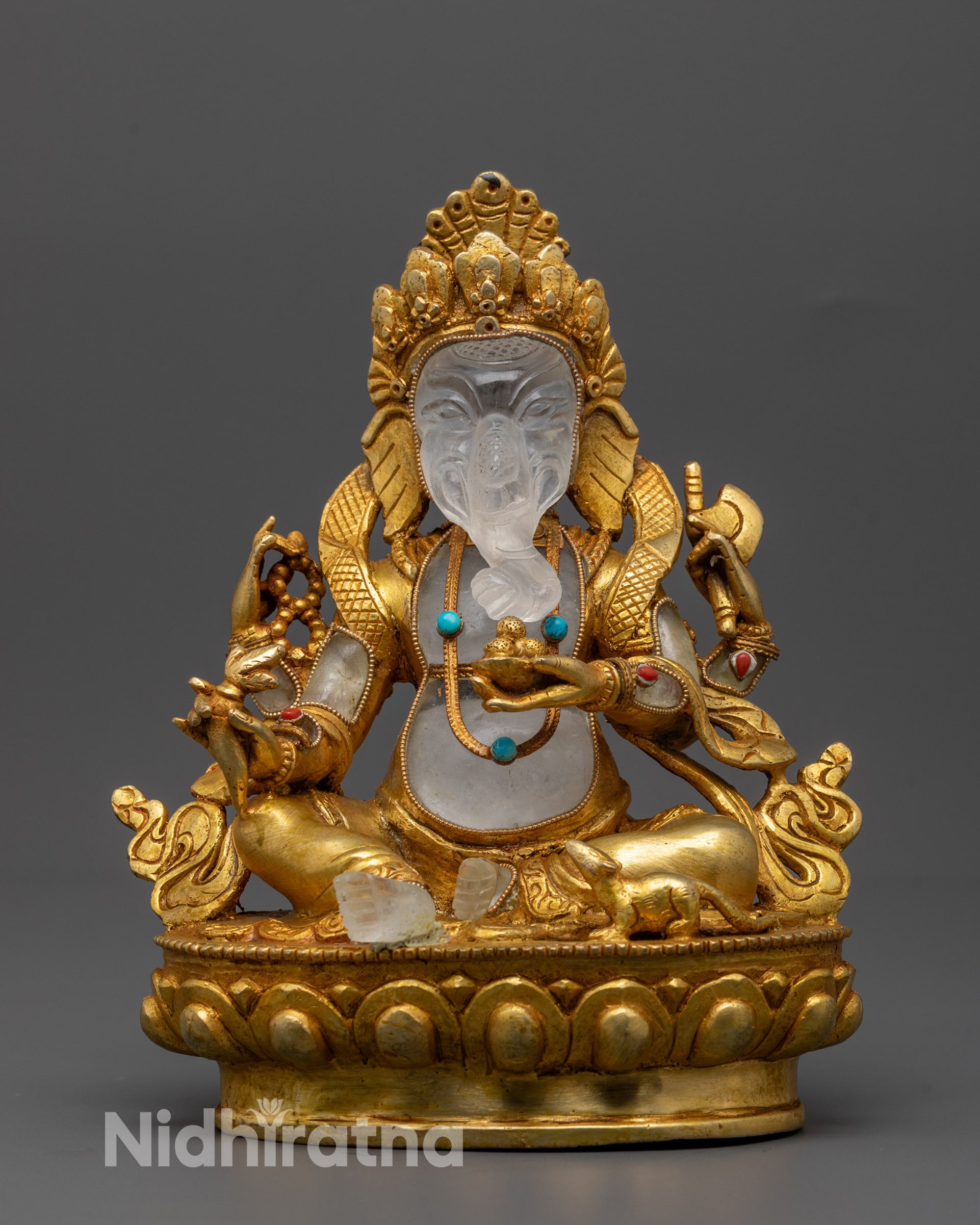 Front view of gold-plated Ganesh statue with crystal elements on lotus throne