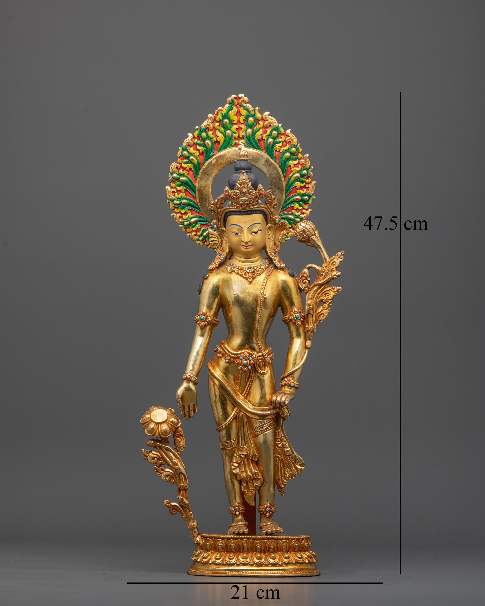 Front view of golden Padmapani statue standing on lotus base with radiant halo