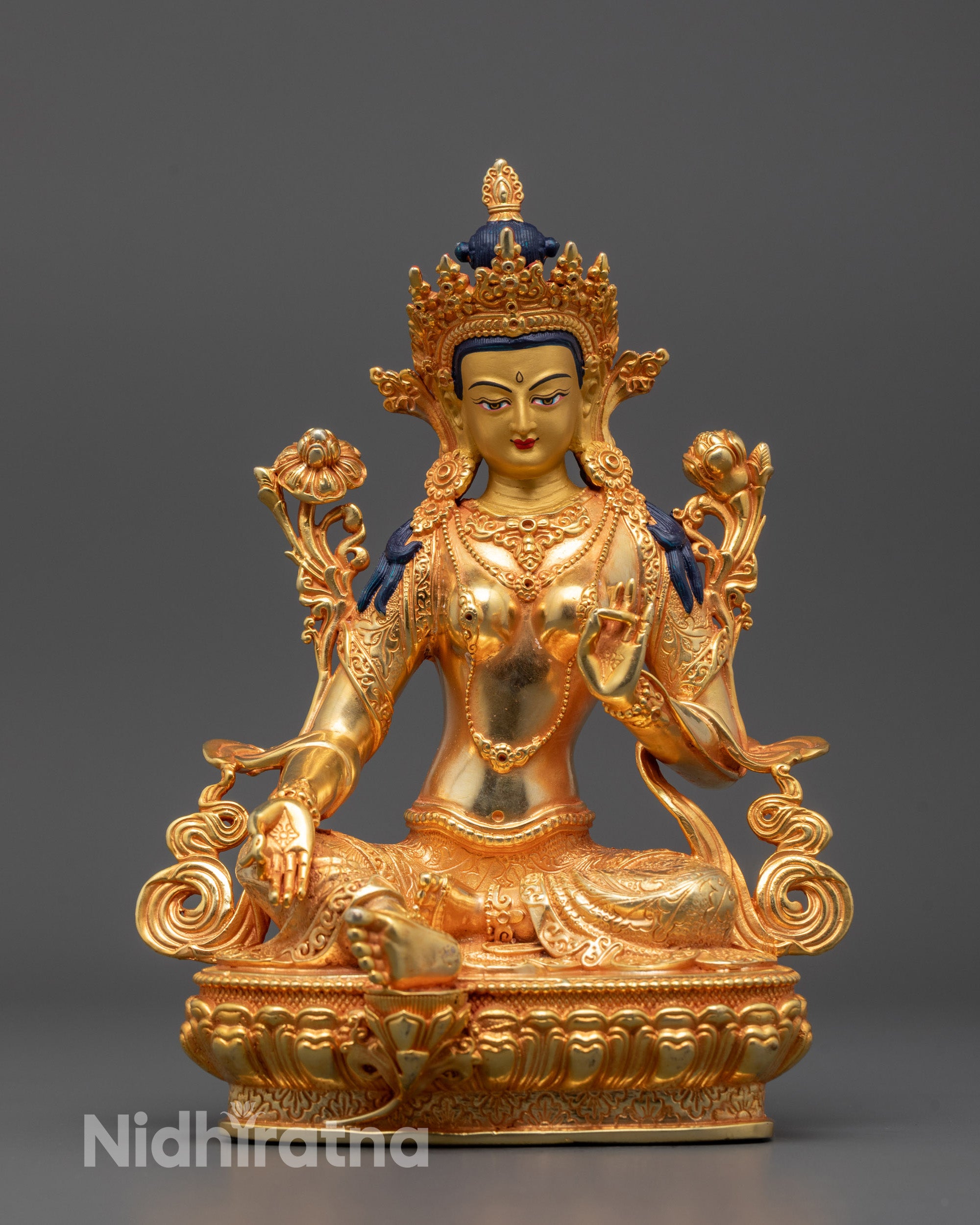 Front view of hand-carved Green Tara Statue seated on lotus with right hand in varada mudra