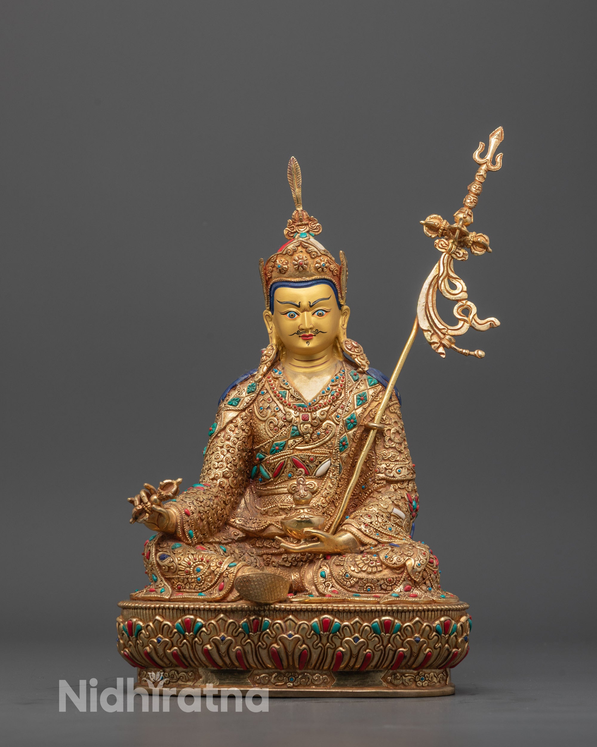 Front view of hand-carved Guru Rinpoche Statue seated on lotus with semi-wrathful expression