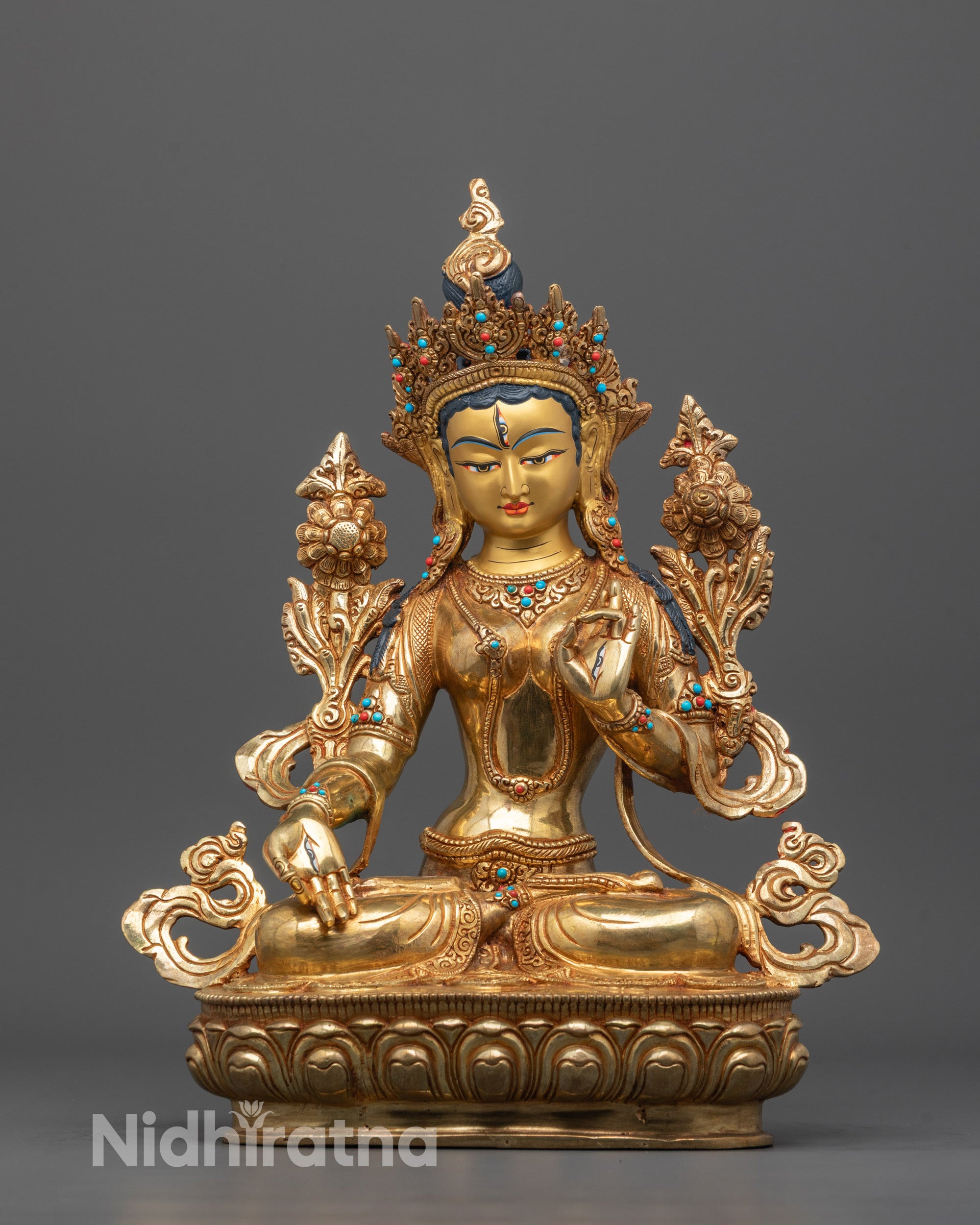 Front view of hand-carved White Tara statue from Nepal in 24k gold-plated copper
