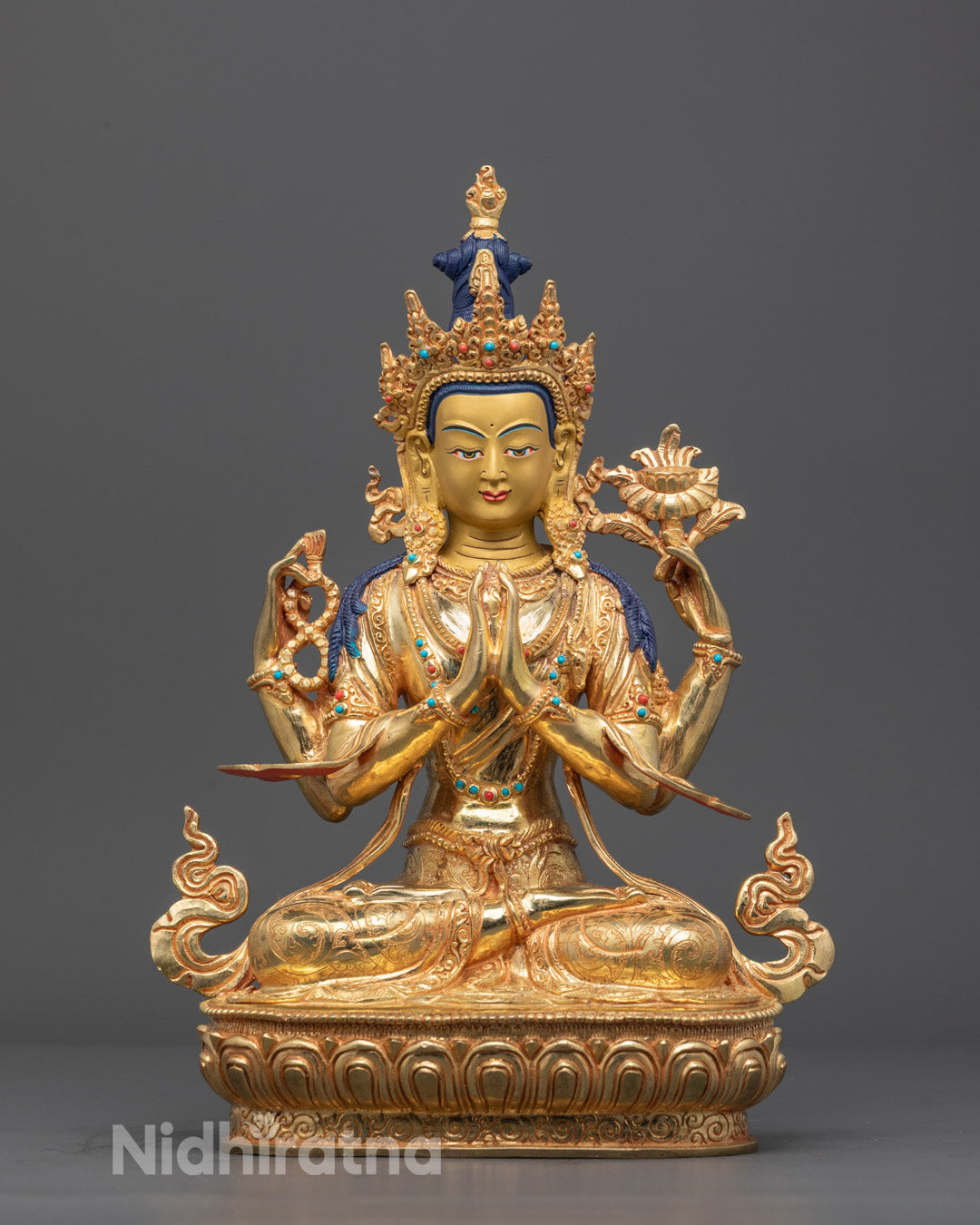 Front view of handcrafted Chenrezig statue seated on a double lotus base