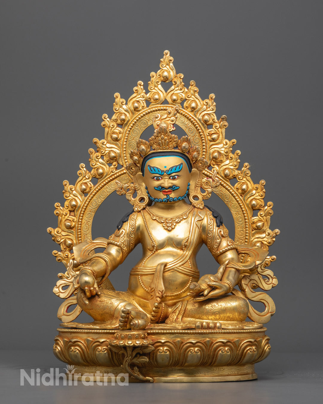 Front view of handcrafted Dzambhala sculpture with 24k gold face and acrylic details.