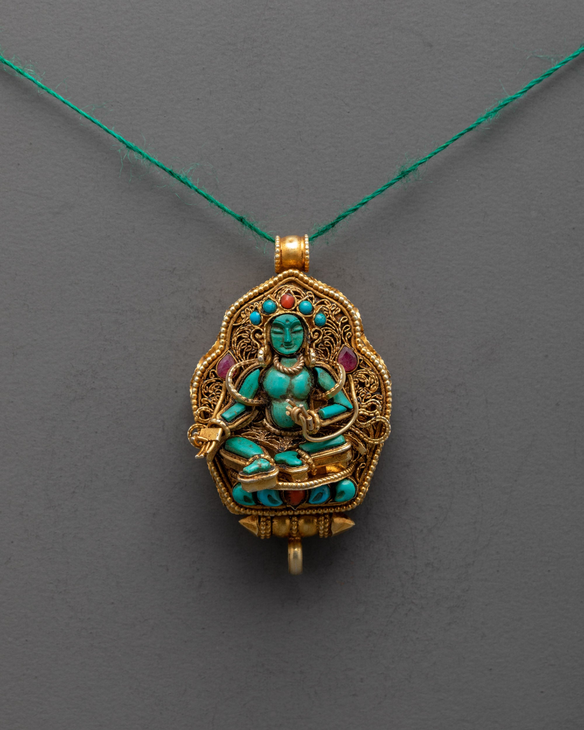 Front view of handcrafted Green Tara Locket with turquoise and gold-plated filigree design
