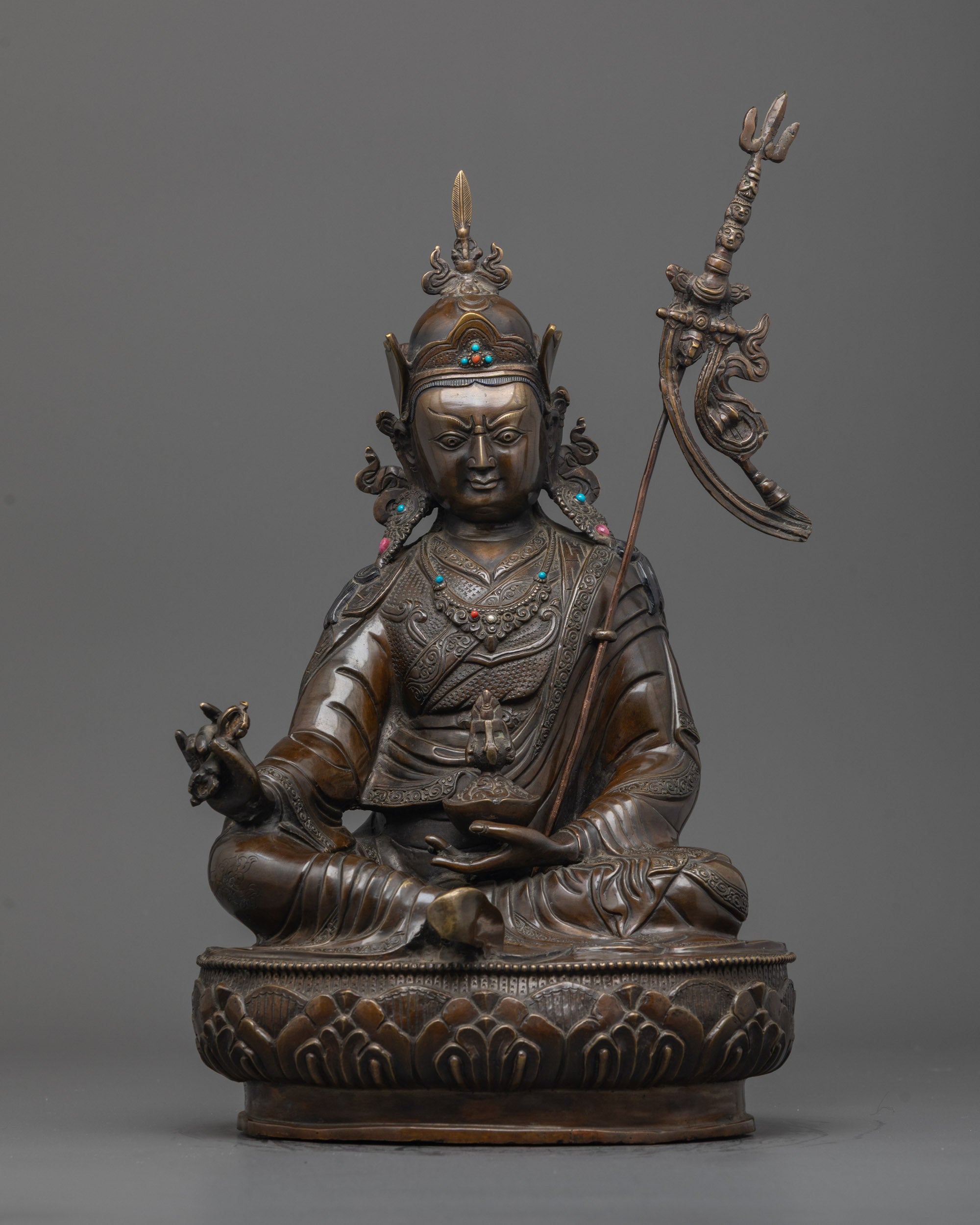 Front view of handcrafted Oxidized Guru Rinpoche Statue with crown and vajra details