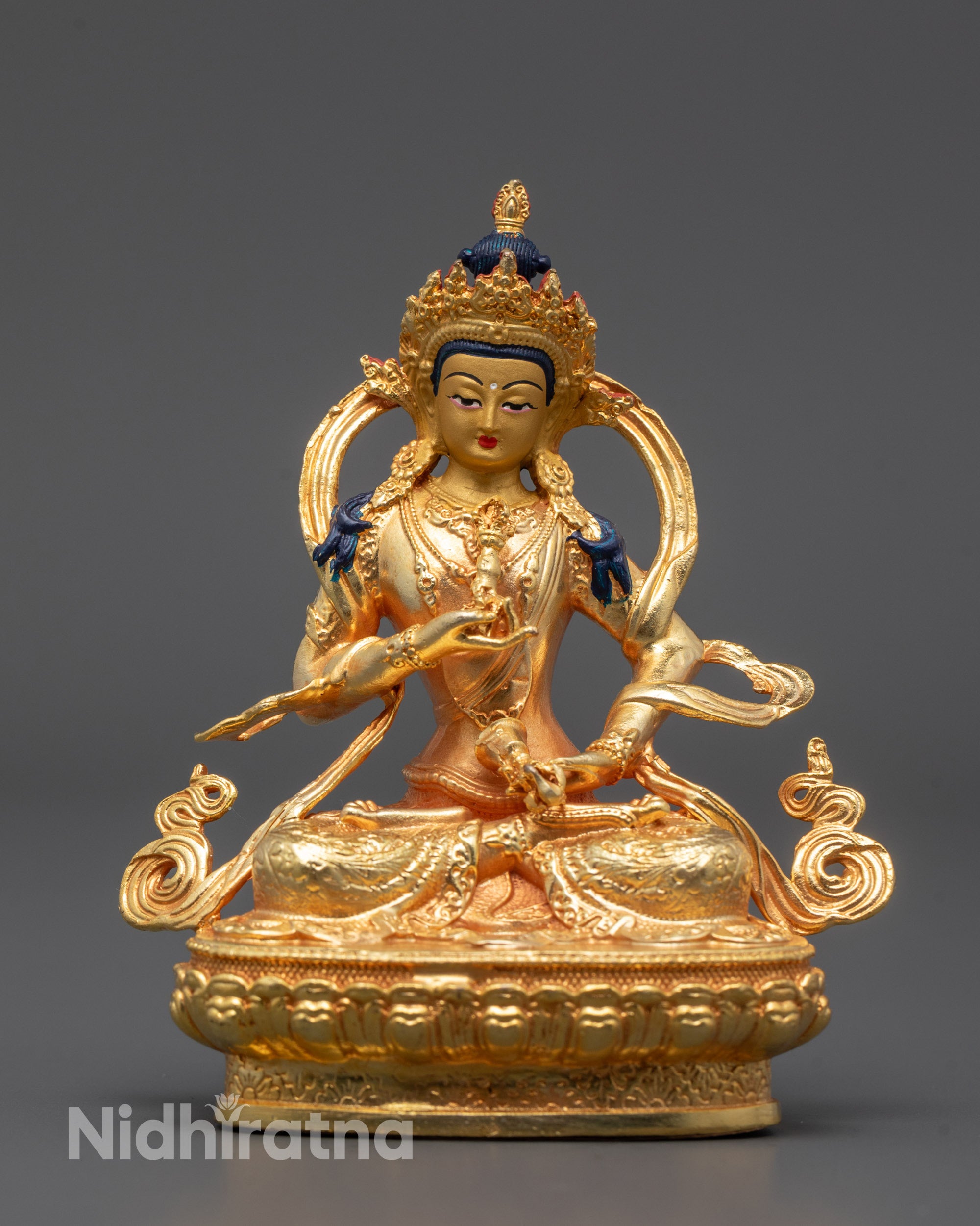 Front view of machine-made Vajrasattva statue seated on lotus base