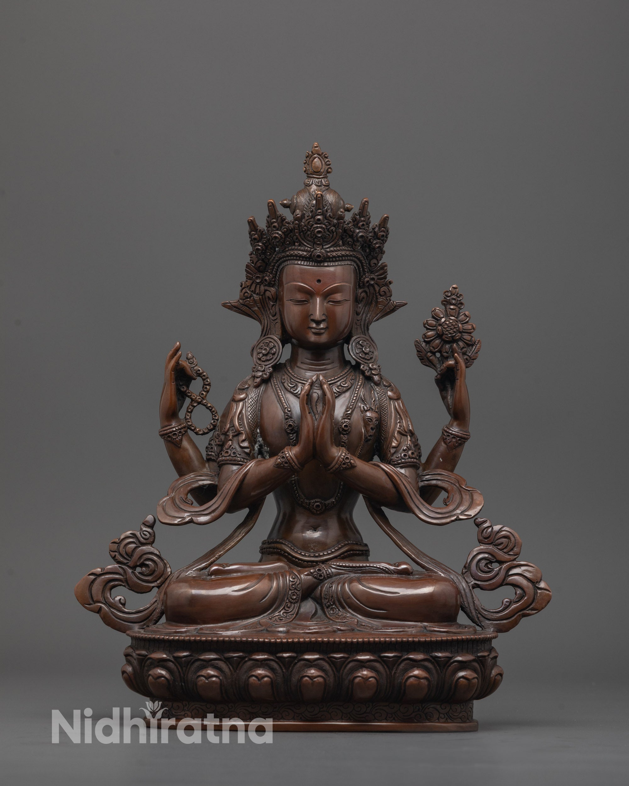 Front view of oxidized Chenrezig statue with crown and lotus base, handmade in copper