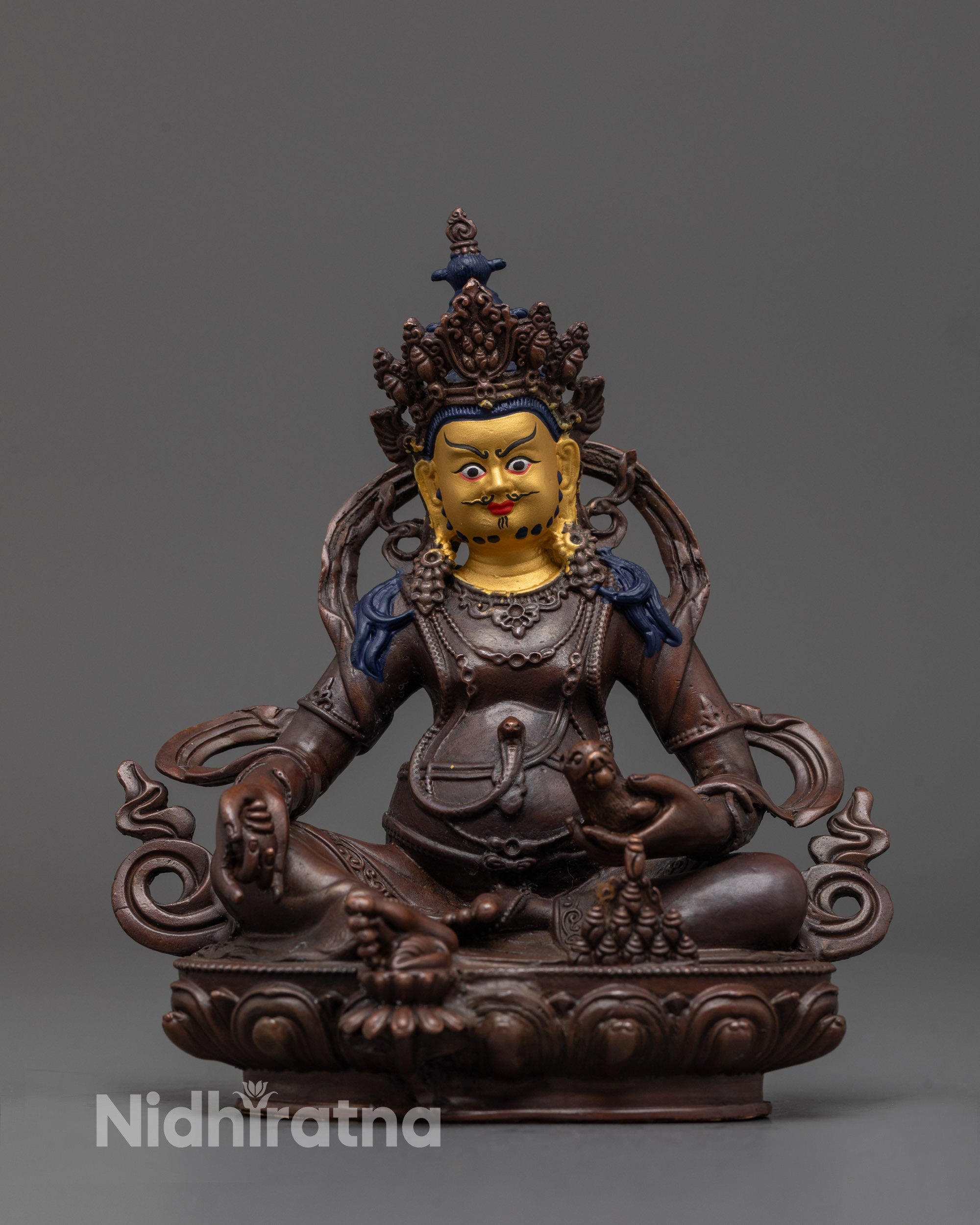 Front view of oxidized Dzambhala statue with gold-plated face and jewel-spitting mongoose
