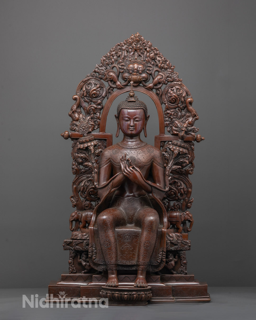 Front view of oxidized Maitreya Buddha statue in Dharmachakra Mudra on Singhasana throne