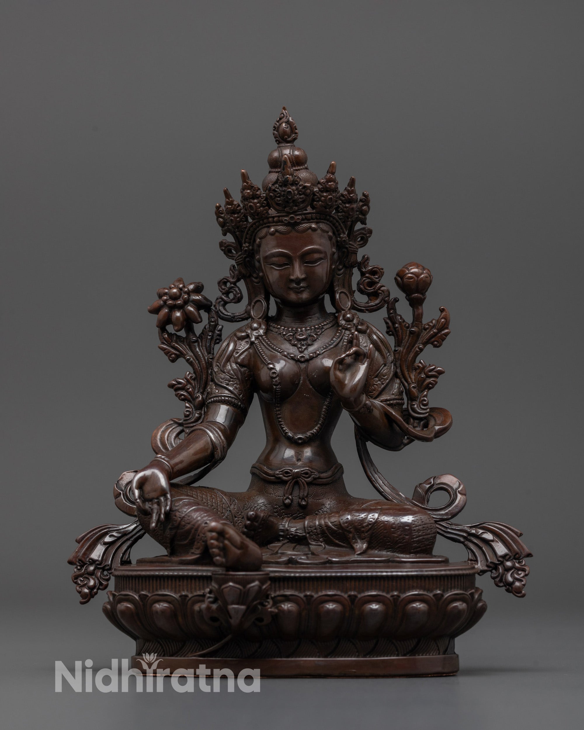 Front view of oxidized copper Green Tara statue in royal ease pose with rich antique finish