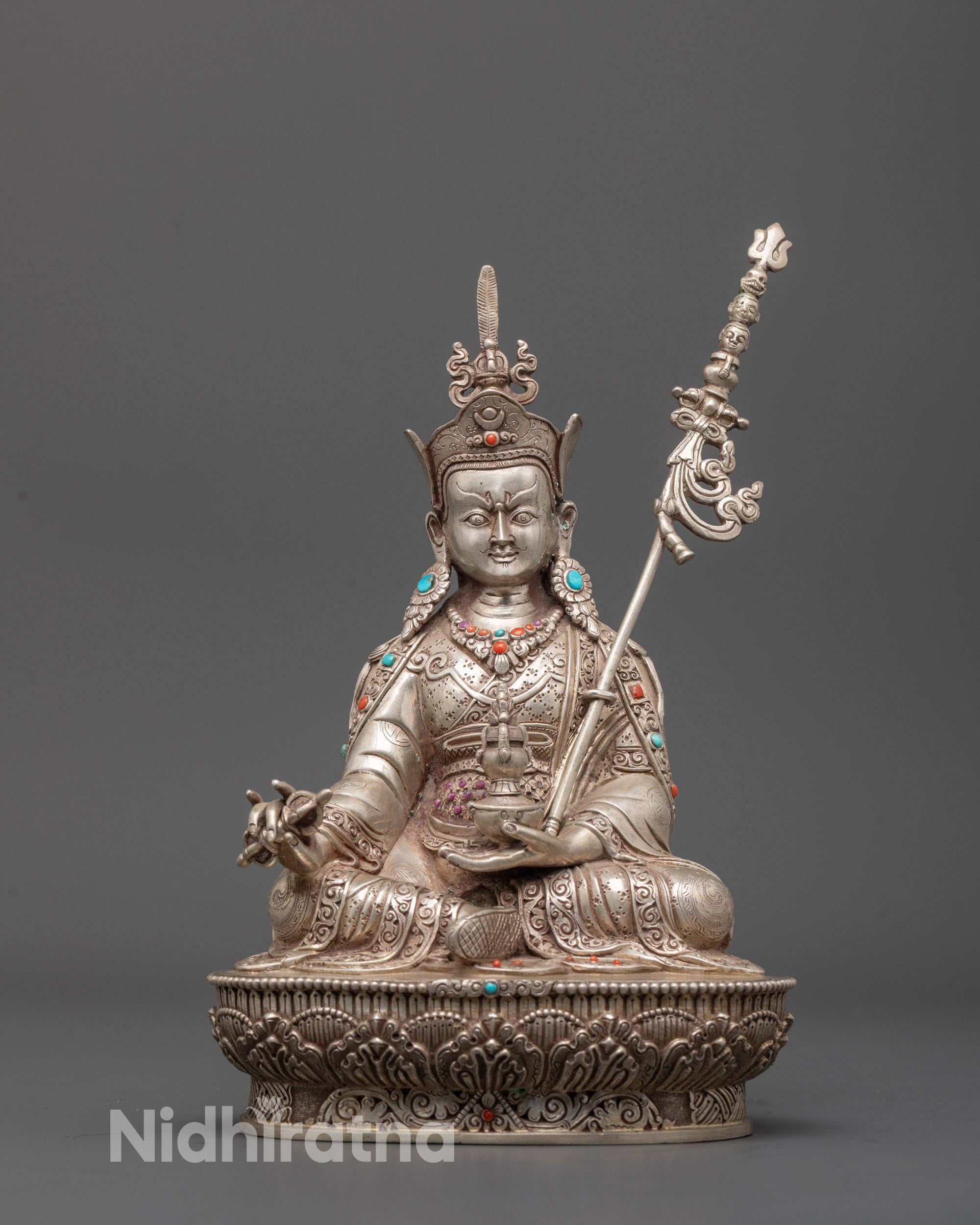 Front view of pure silver Guru Rinpoche statue with semi-precious stones and lotus base