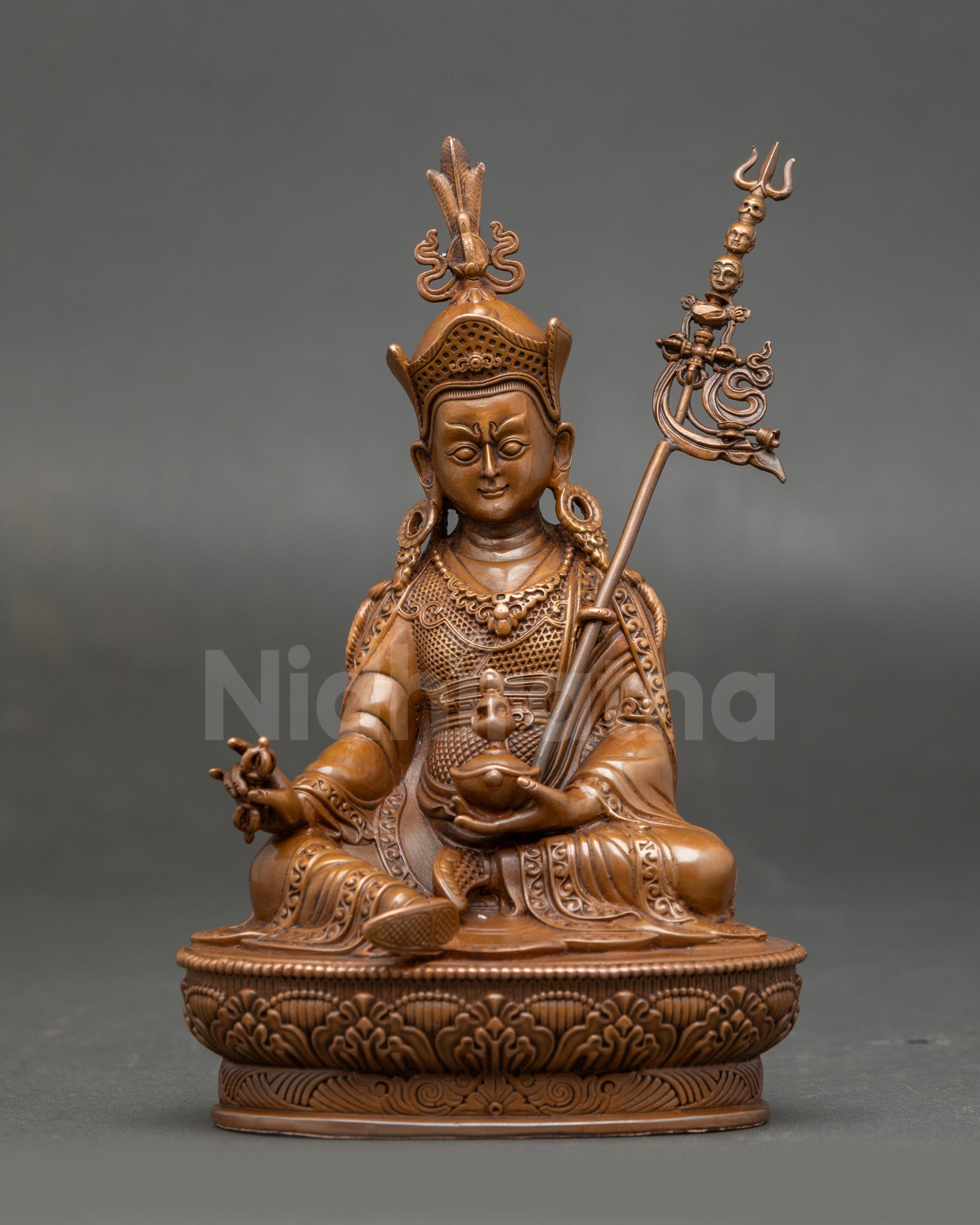 Front view of the Guru Rinpoche Vajrayana statue with oxidised Nepal finish, seated on a lotus