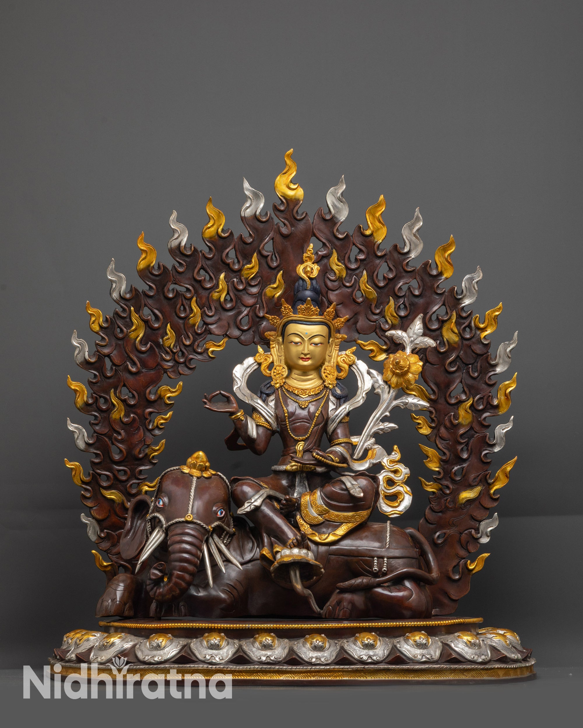 Handcrafted Samantabhadra Bodhisattva statue seated on elephant, oxidized copper with silver plating and gold-gilded face