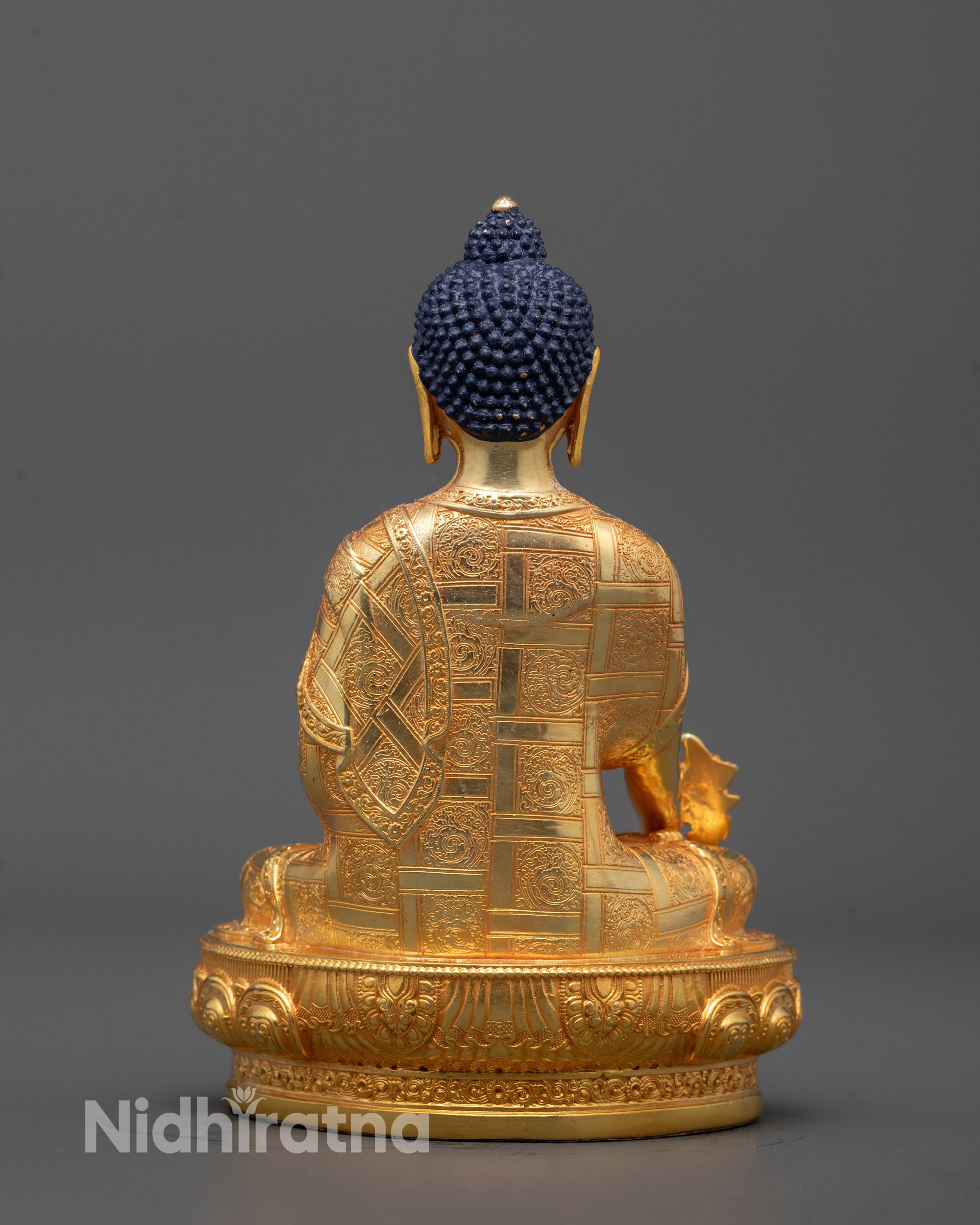 Full front view of Medicine Buddha sculpture featuring peaceful posture