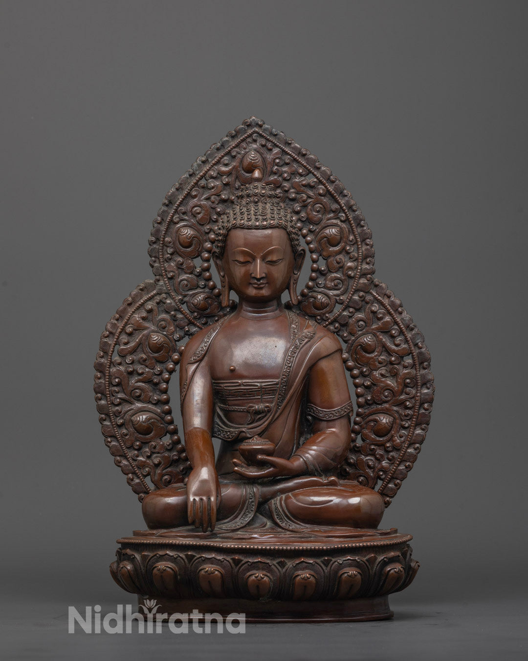 Full image of Hand-carved Siddhartha Gautama statue made of oxidized copper,