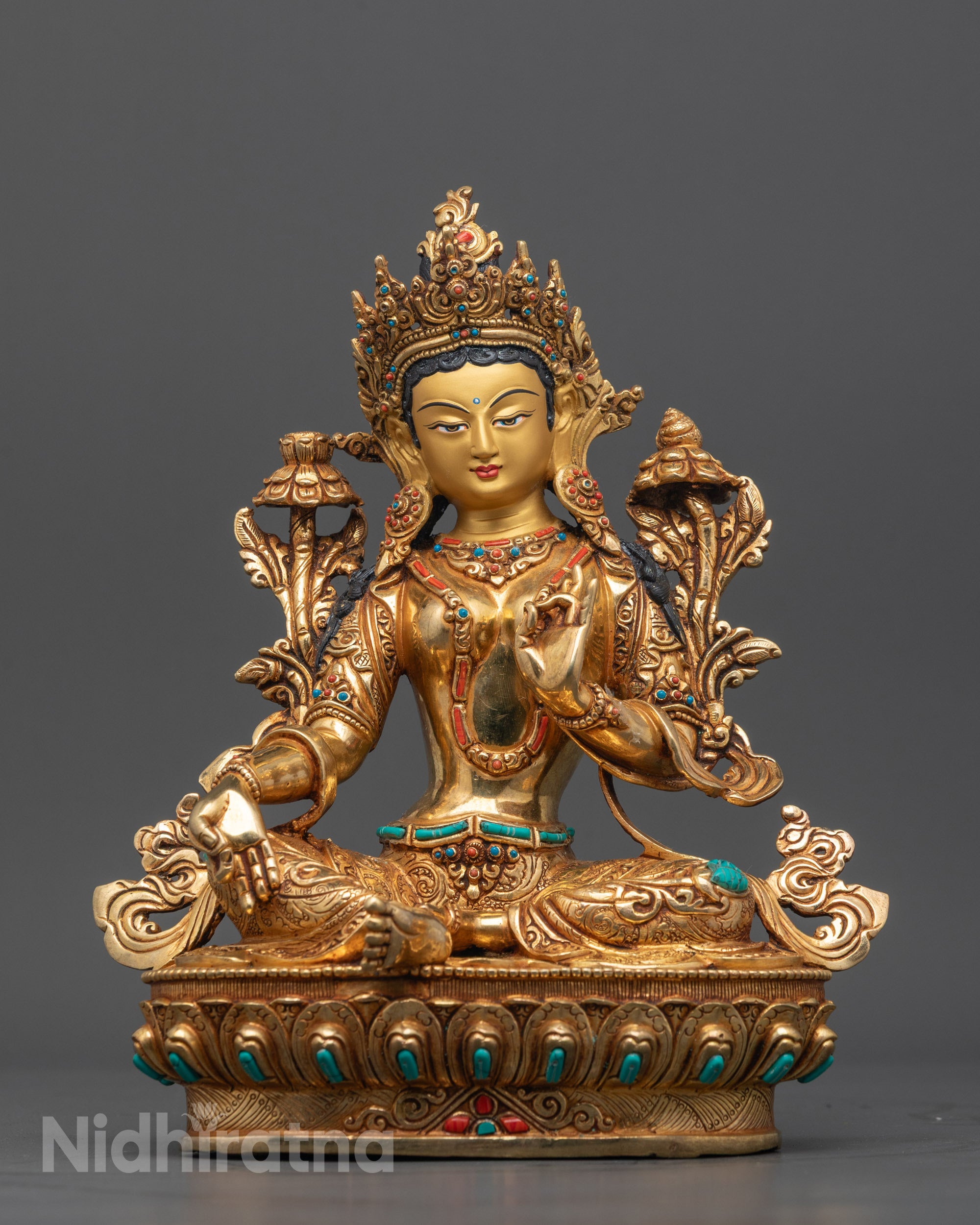 Front view of Nepalese Green Tara statue with gold gilding for meditation