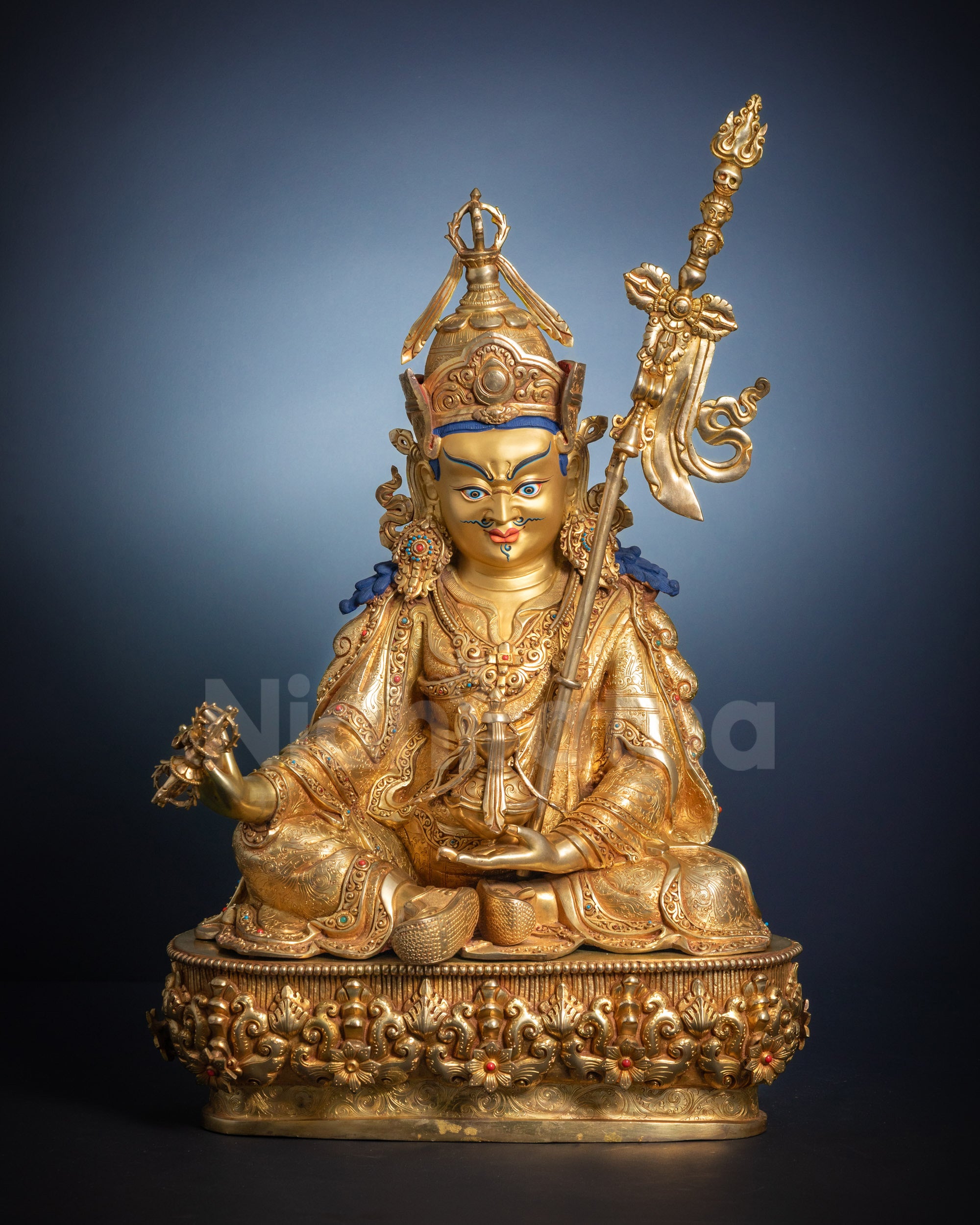 Full view Guru Rinpoche statue with dorje skull cup and khatvanga staff