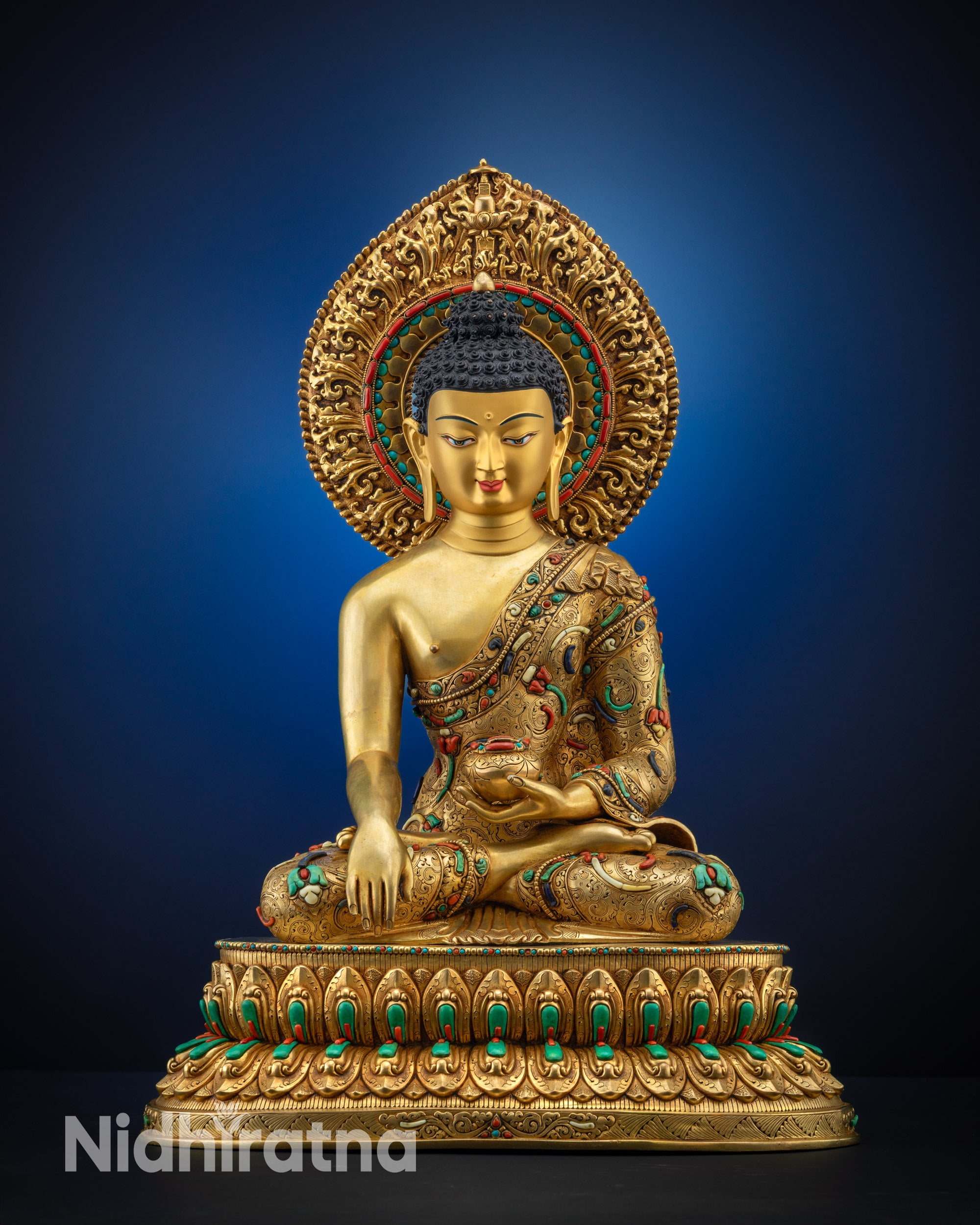 Full view Shakyamuni Buddha statue gold fire gilded body and halo on lotus seat front view