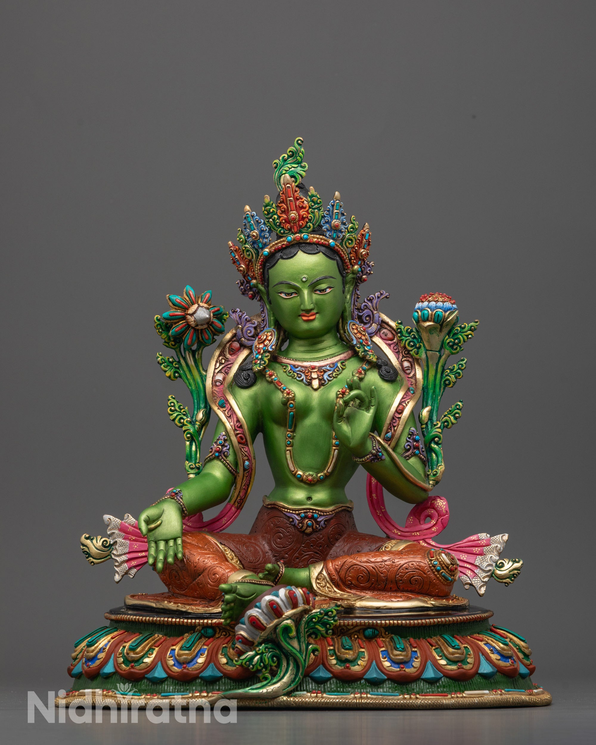 Full view of Hand-carved Green Tara Statue seated on a lotus base in varada mudra