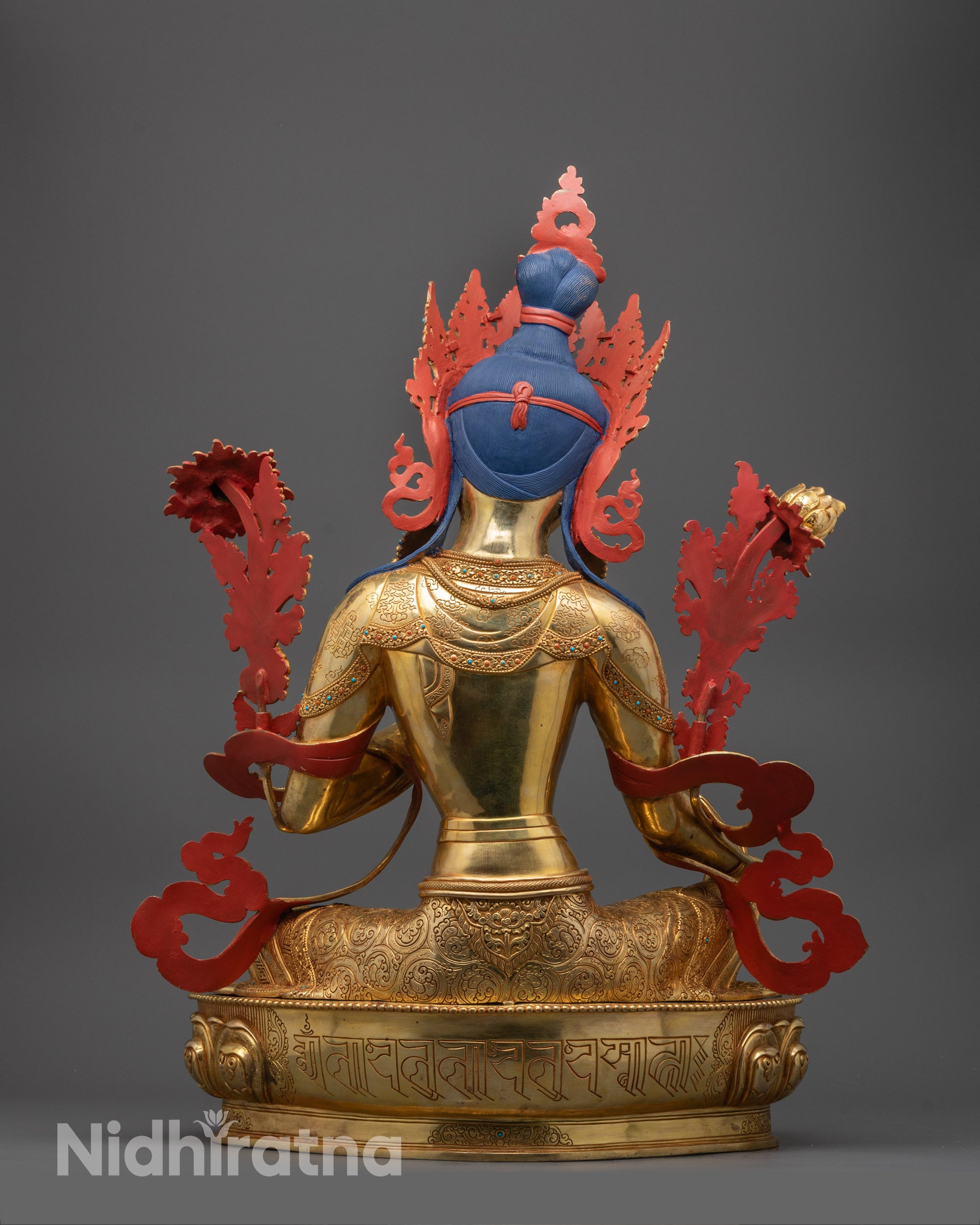 Full view of artisan-made Green Tara Buddhist statue with vibrant gold surface