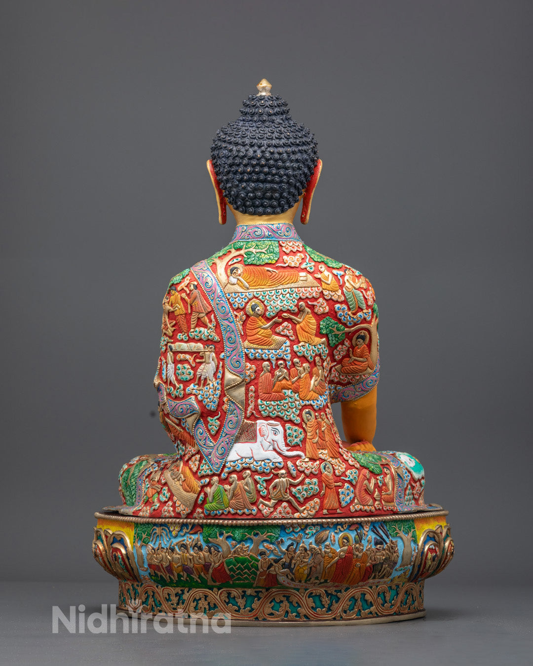 intricately designed Shakyamuni Buddha statue with 24k gold fire gilding and hand-painted yellow acrylic colors.
