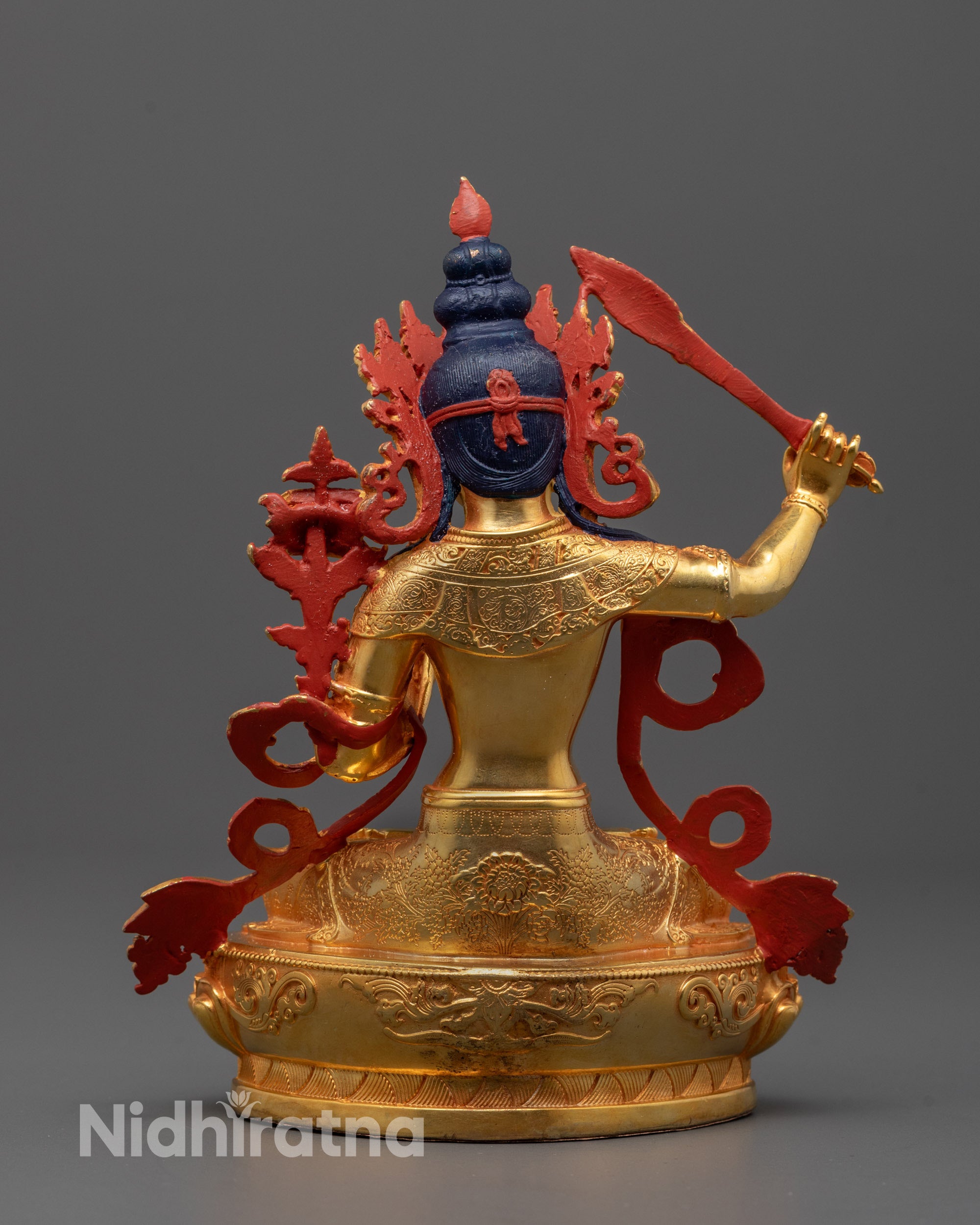 Full view of machine-crafted Manjushri statue on lotus seat representing Bodhisattva