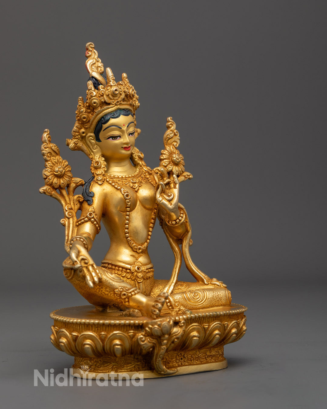 handcrafted Green Tara statue seated in lotus posture, symbolizing compassion and swift protection.