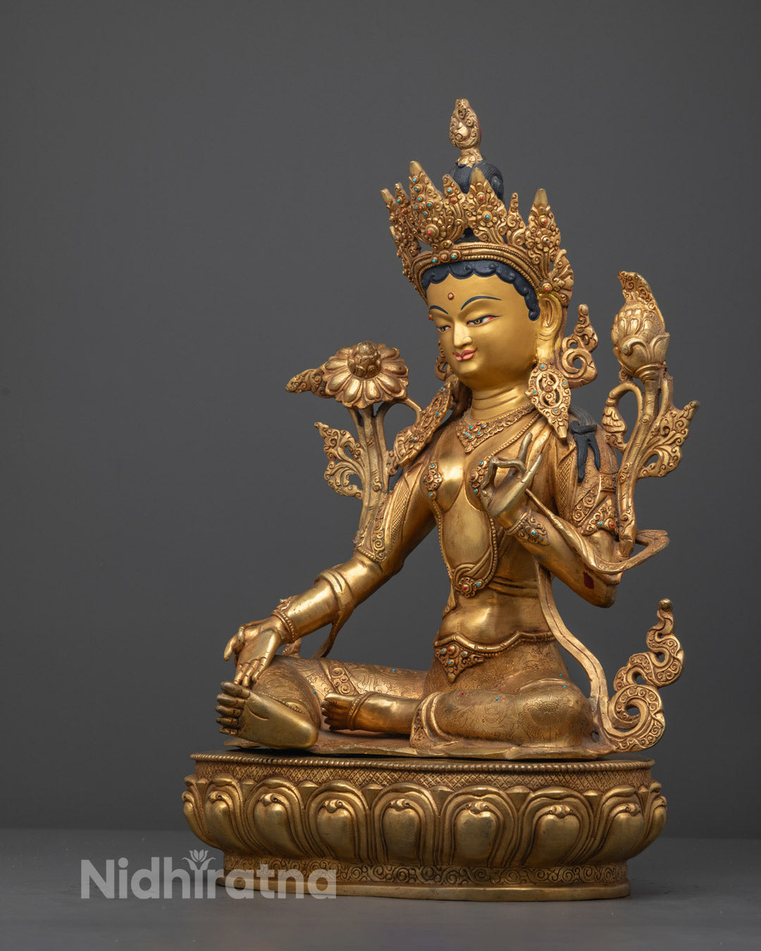 the authentic Nepalese Green Tara Statue showcasing intricate design, 24k gold gilding, and colorful acrylic enhancements.