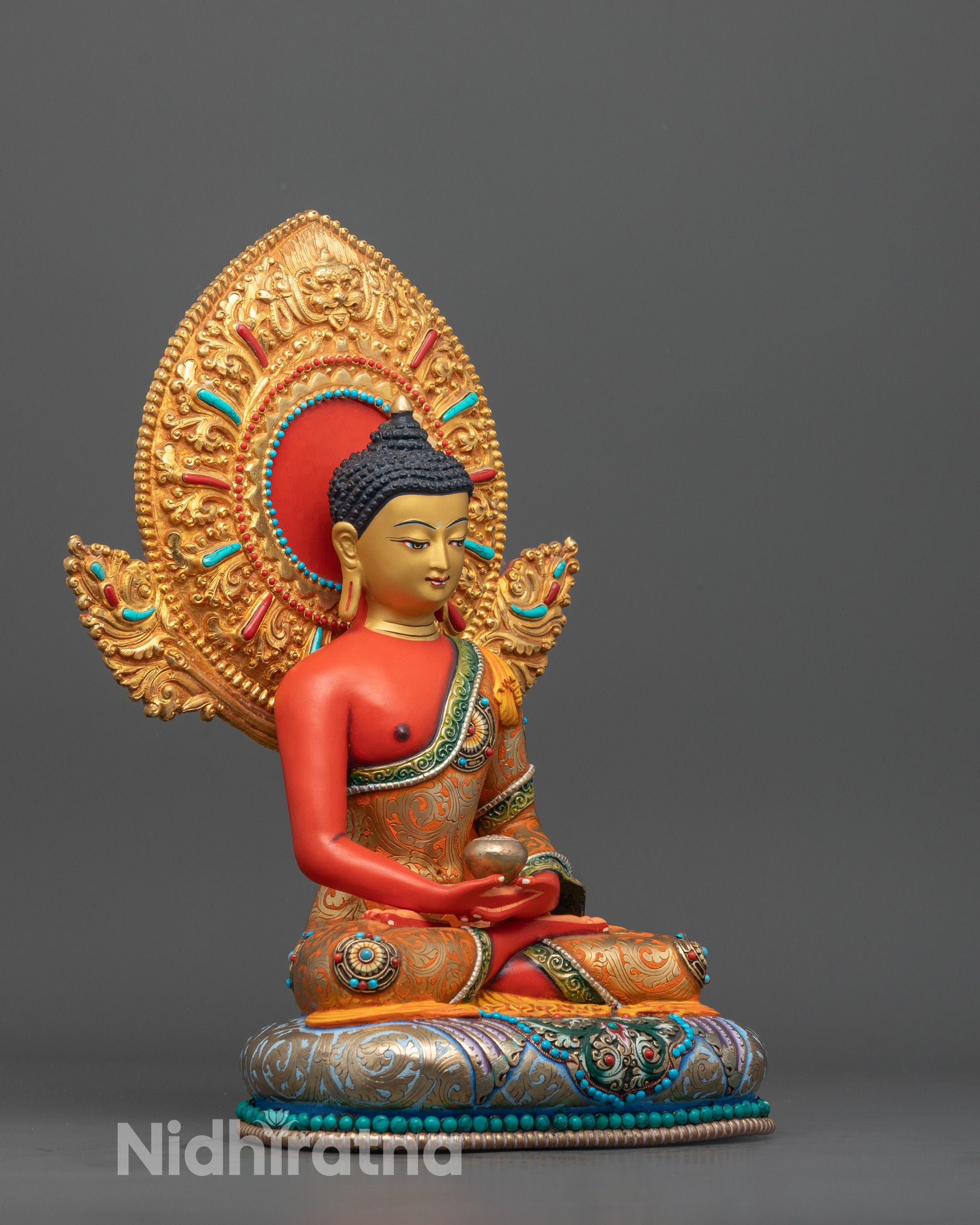 Full view of vibrant Amitabha Buddha statue featuring red acrylic color