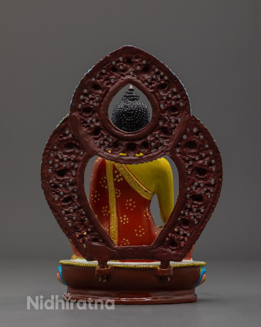 yellow Shakyamuni Buddha sculpture with left hand in Dhyana Mudra, symbolizing meditation and inner peace, handcrafted by Nepal artisans