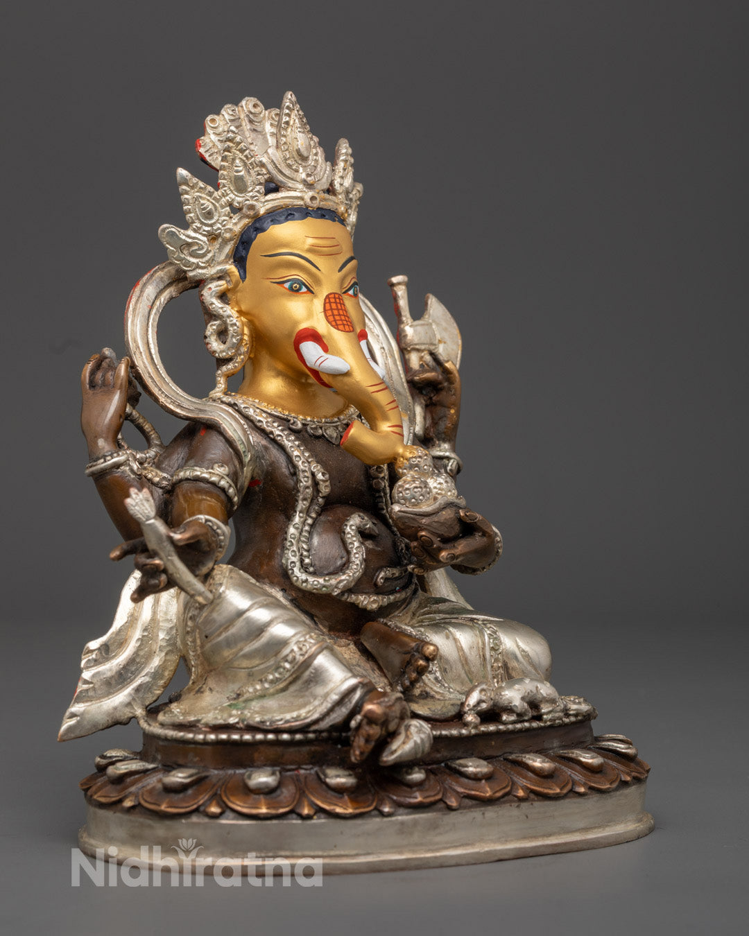 Ganesh murti showing detailed silver-plated floating robe and symbolic hand gestures