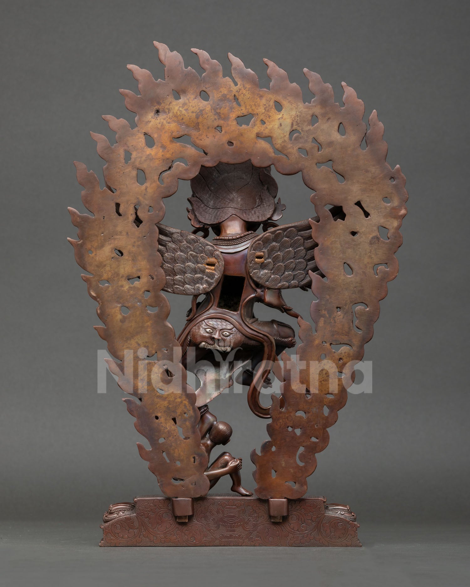 Back view of Garuda statue oxidized copper finish intricate detailing wings ornaments traditional Himalayan artisan statue