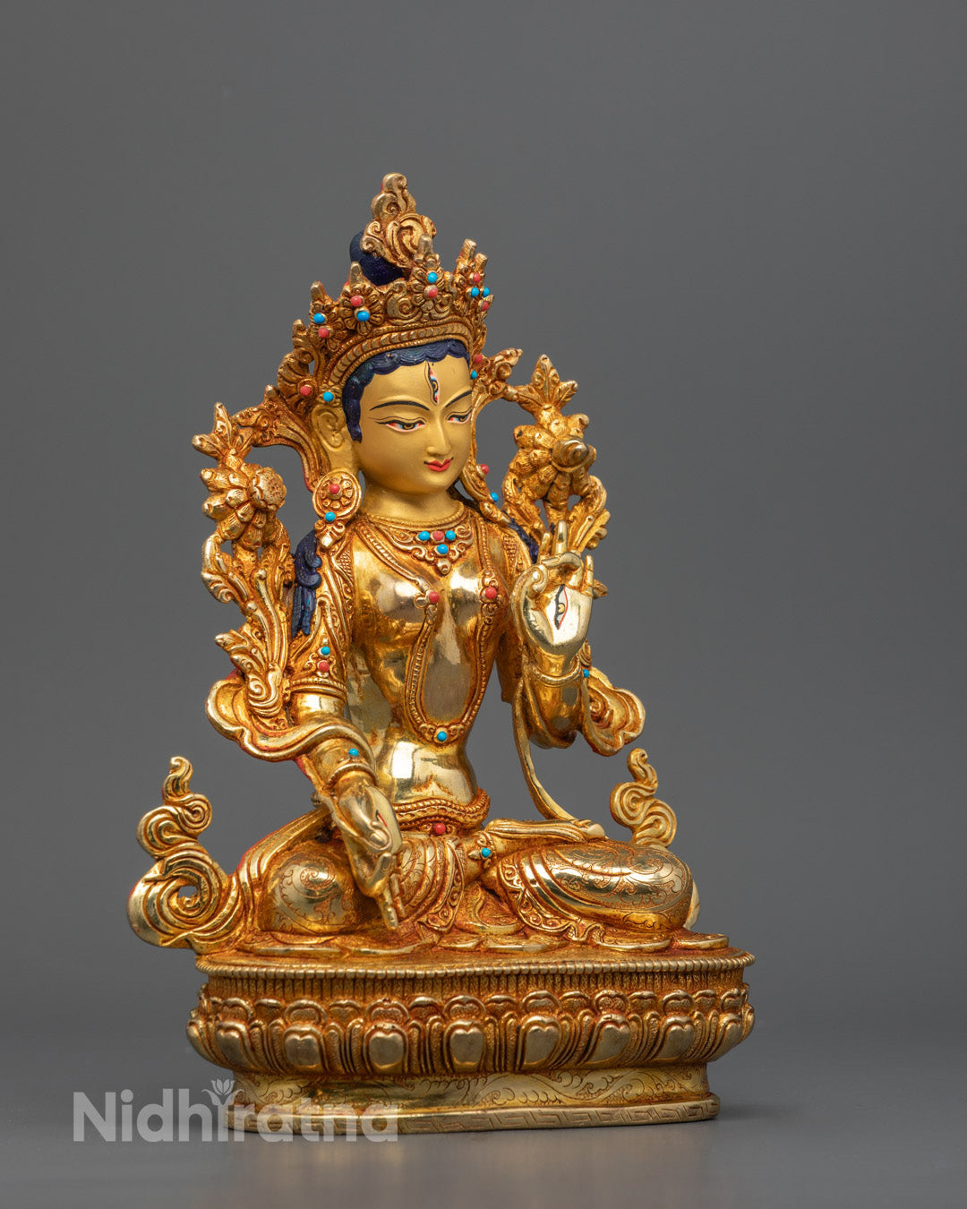 A beautifully crafted White Tara statue seated in a meditative posture, adorned with intricate details and 24K gold plating, symbolizing healing, compassion, and longevity.