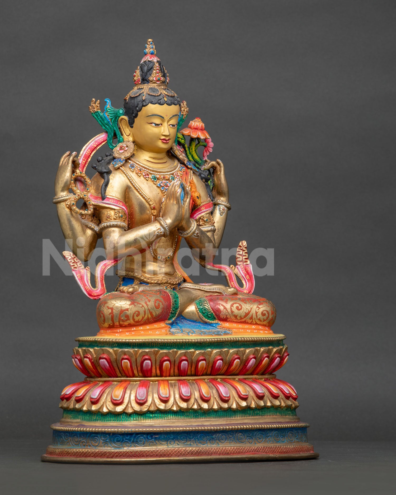 Gold fire-gilded Four-Armed Chenrezig Statue with semi-precious stones.