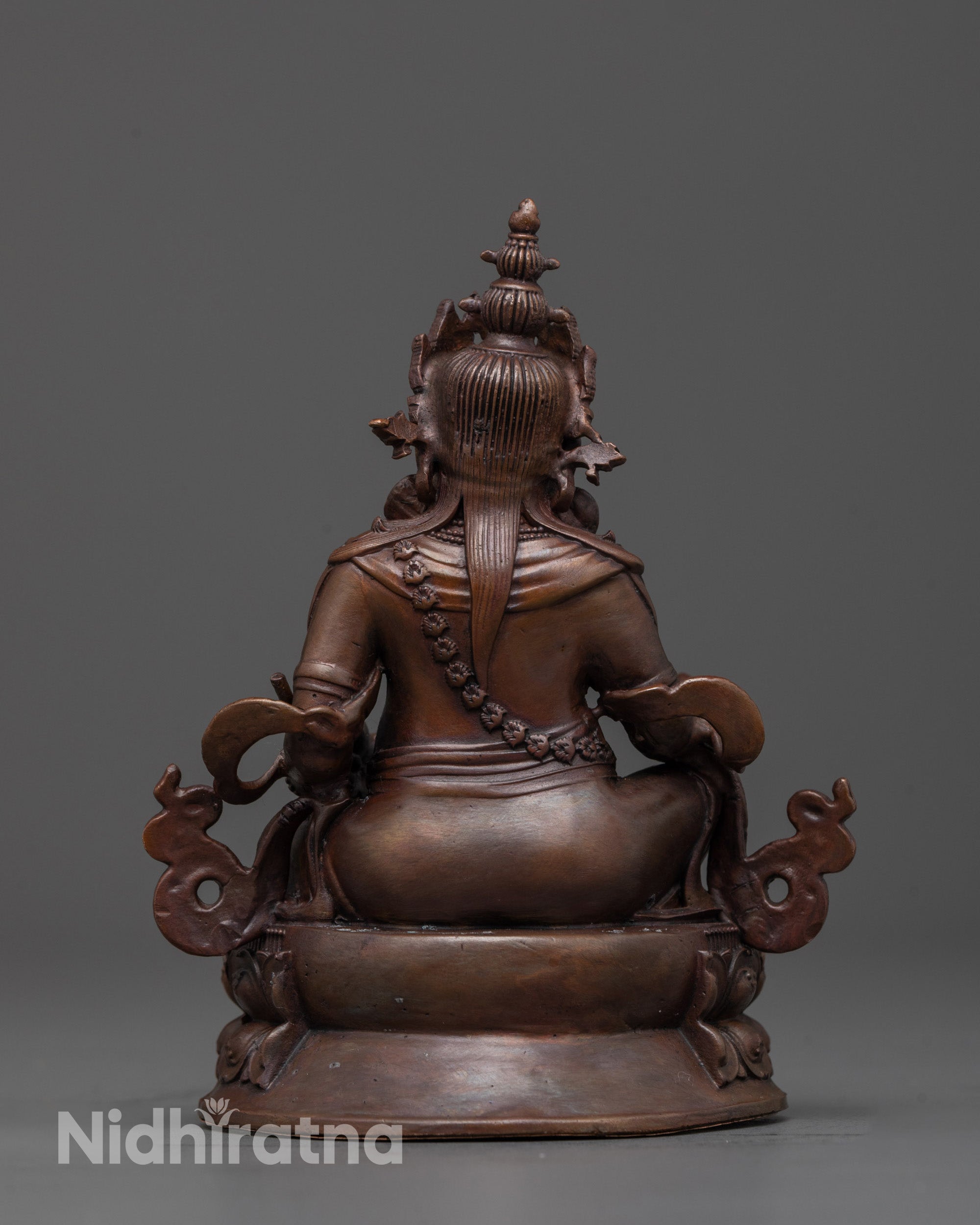 Gold-gilded Dzambhala Statue holding a mongoose seated on double lotus throne