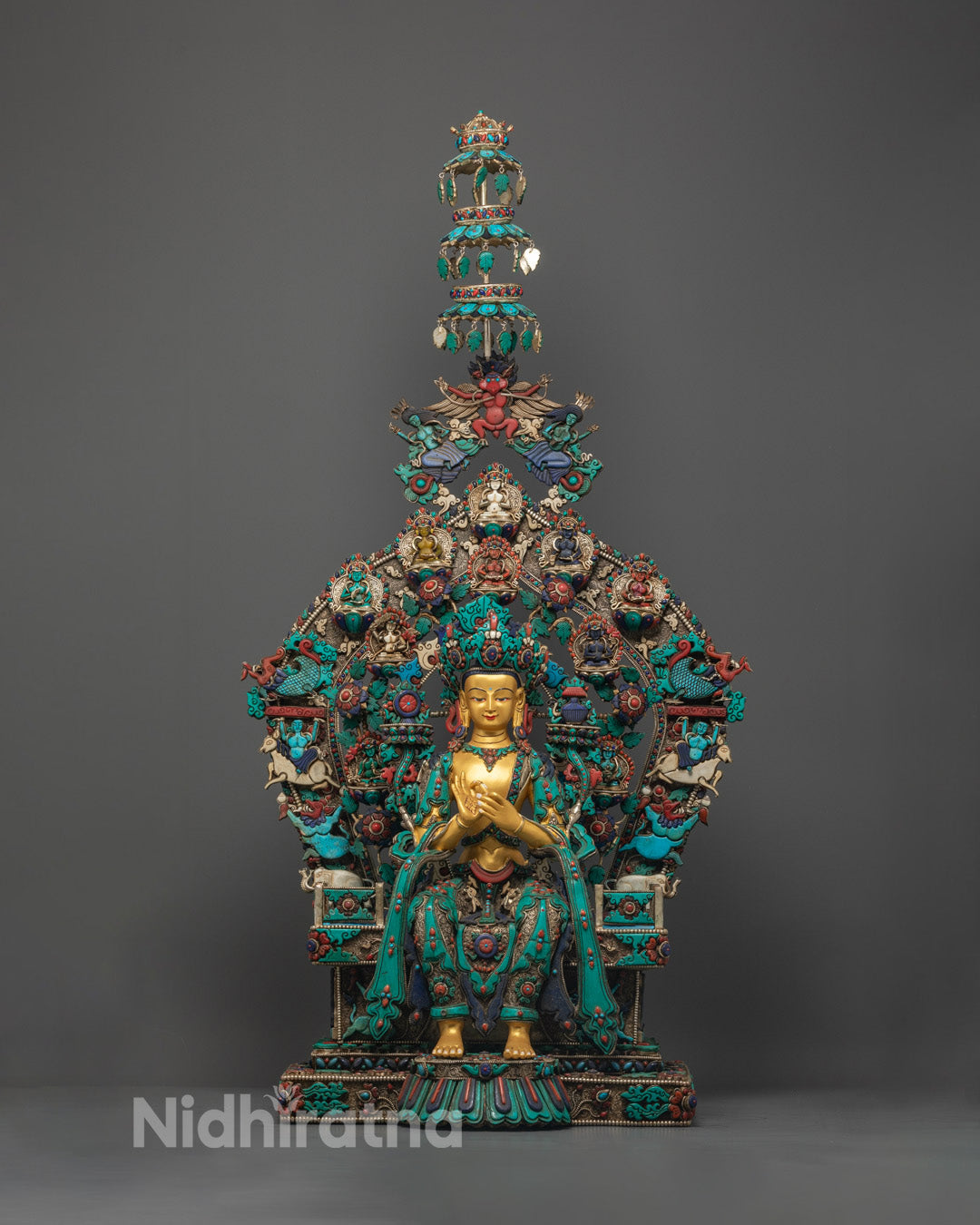Golden Maitreya Buddha statue seated on copper lotus throne, handcrafted in Nepal with semi-precious stone inlays and gold coating