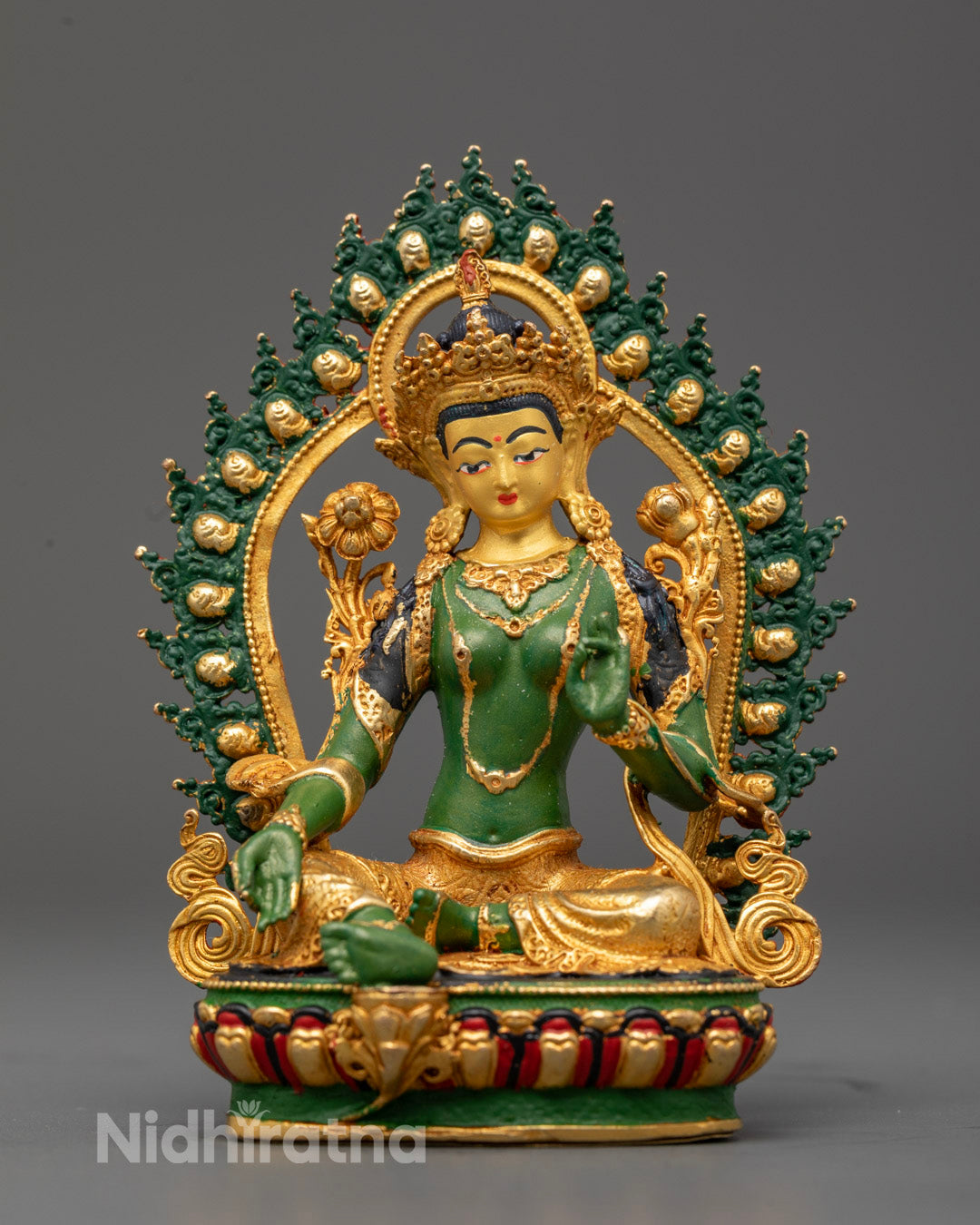 Green-Hued Mother Tara Statue with gold-plated face and intricate acrylic painted details on lotus throne