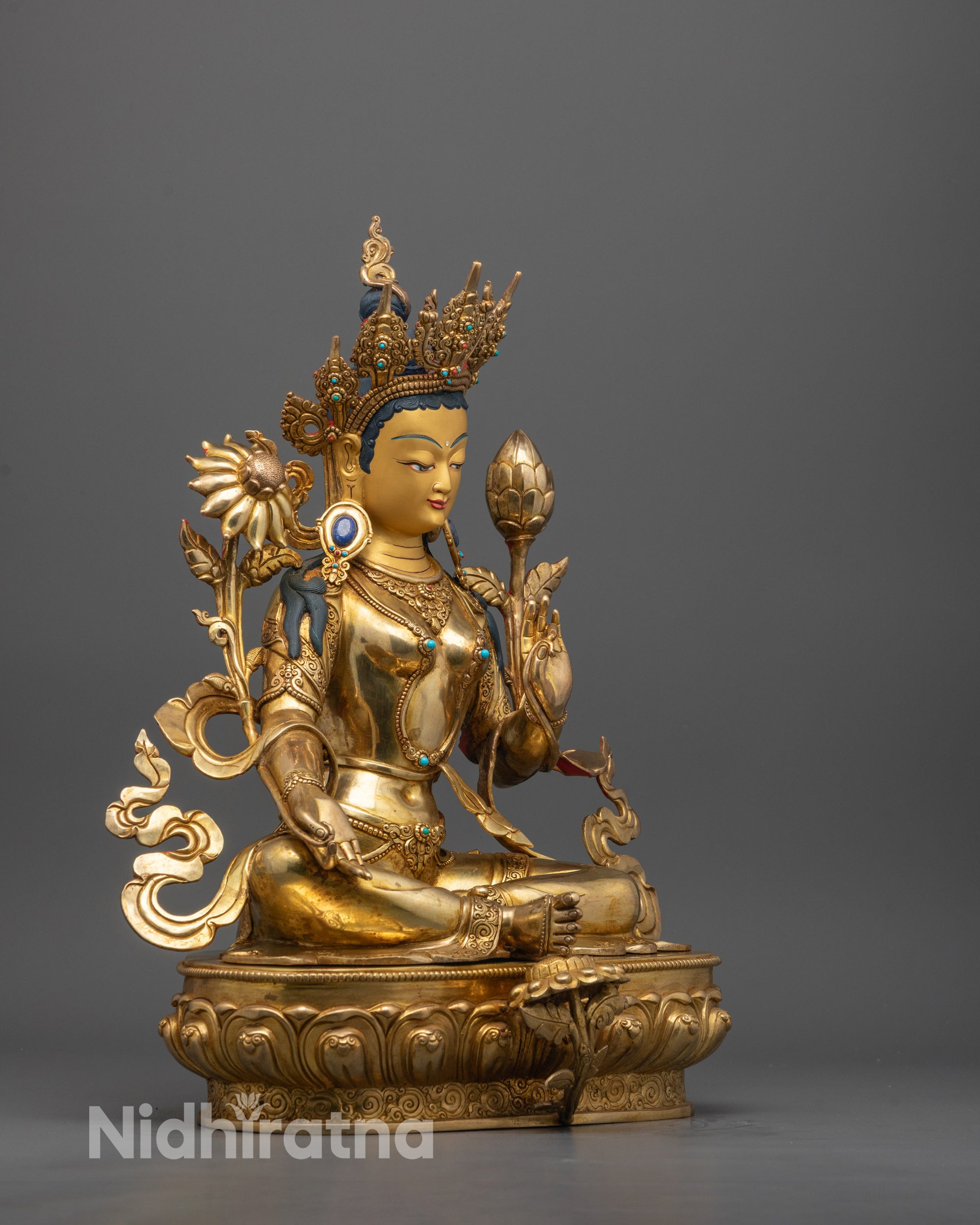 Side angle of Green Tara Statue highlighting intricate detailing on the lotus base