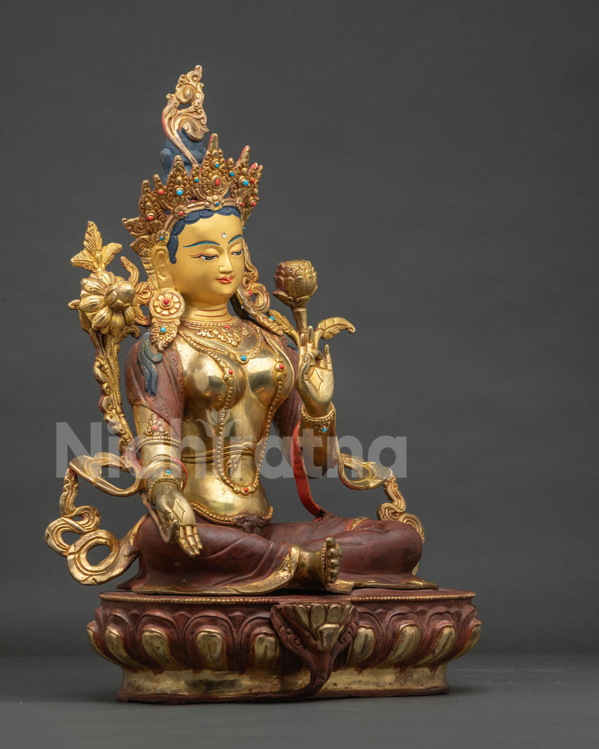 Right side view of Green Tara copper statue showing intricate jewelry and lotus details