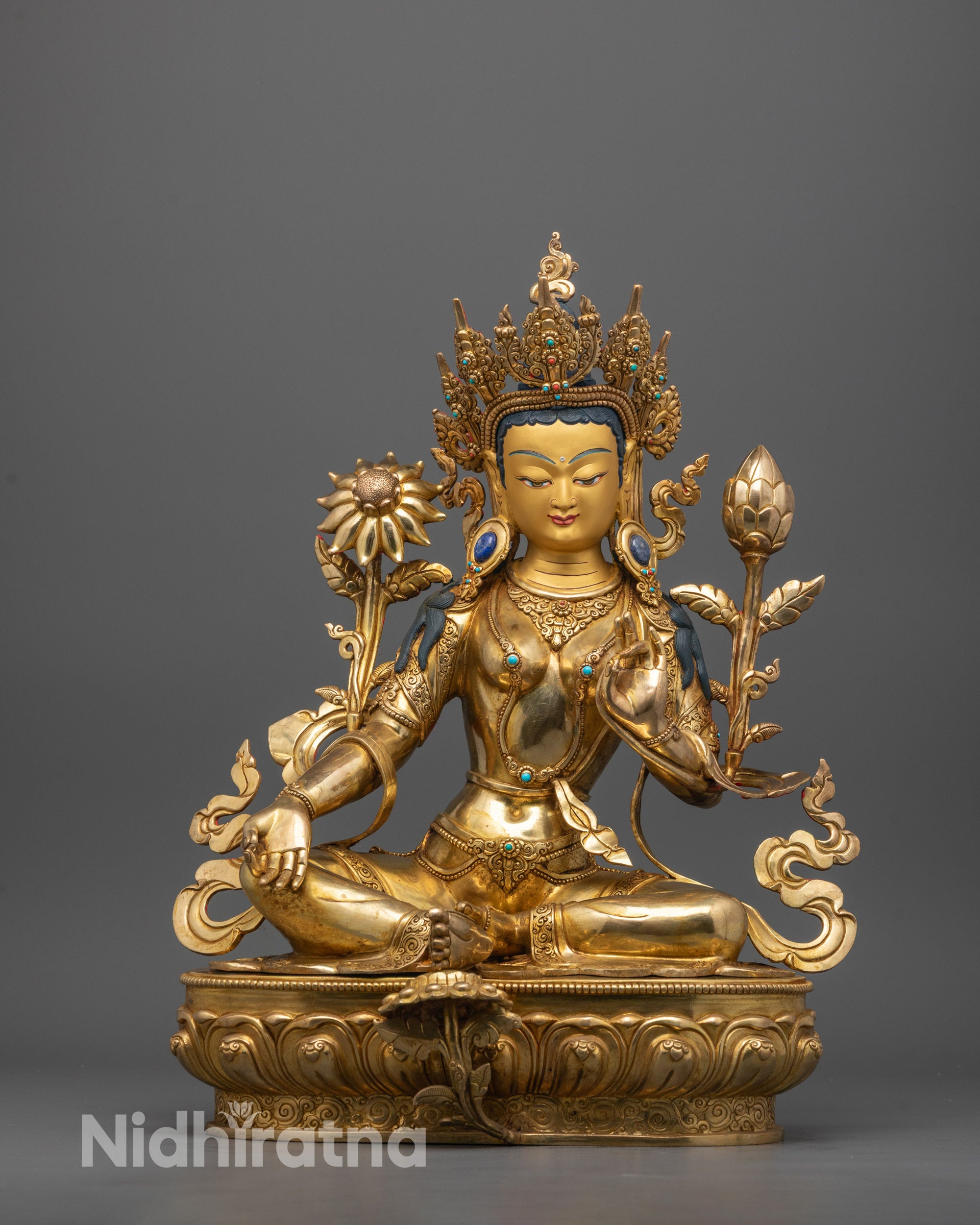 Front view of hand-carved Green Tara Statue seated on lotus throne with right hand in varada mudra