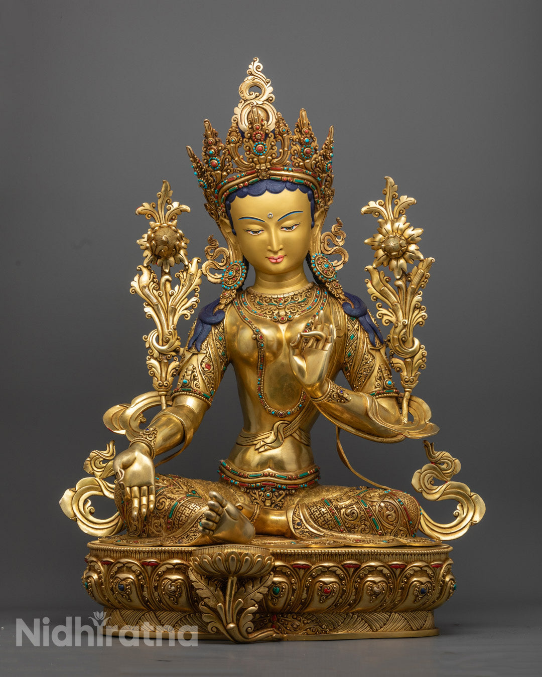 Green Tara statue seated in elegant posture, richly adorned with 24K gold gilding and intricate detailing