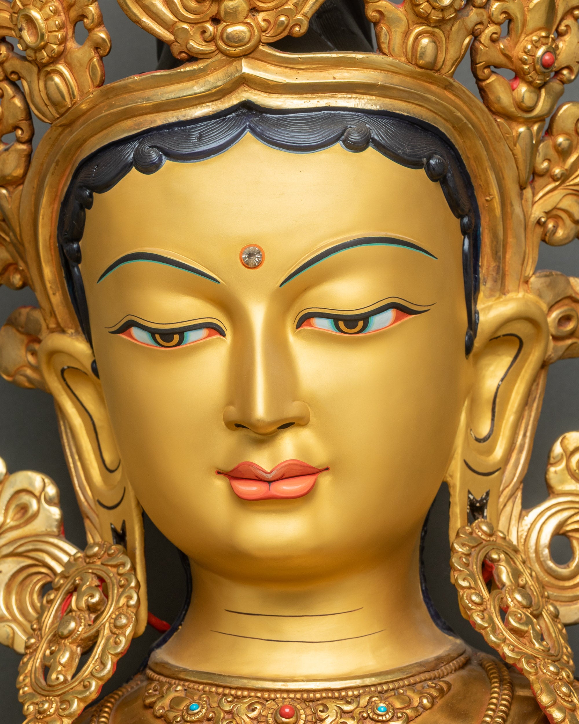 Green Tara Statue Face Close-Up – Gold-Painted Features, Serene Expression & Third Eye Detail