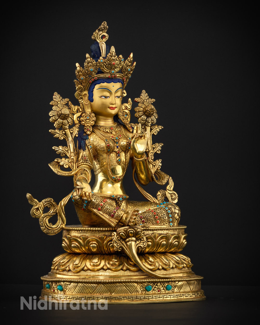 Goddess Green Tara's serene face with 24k gold plating, showcasing intricate craftsmanship and divine radiance