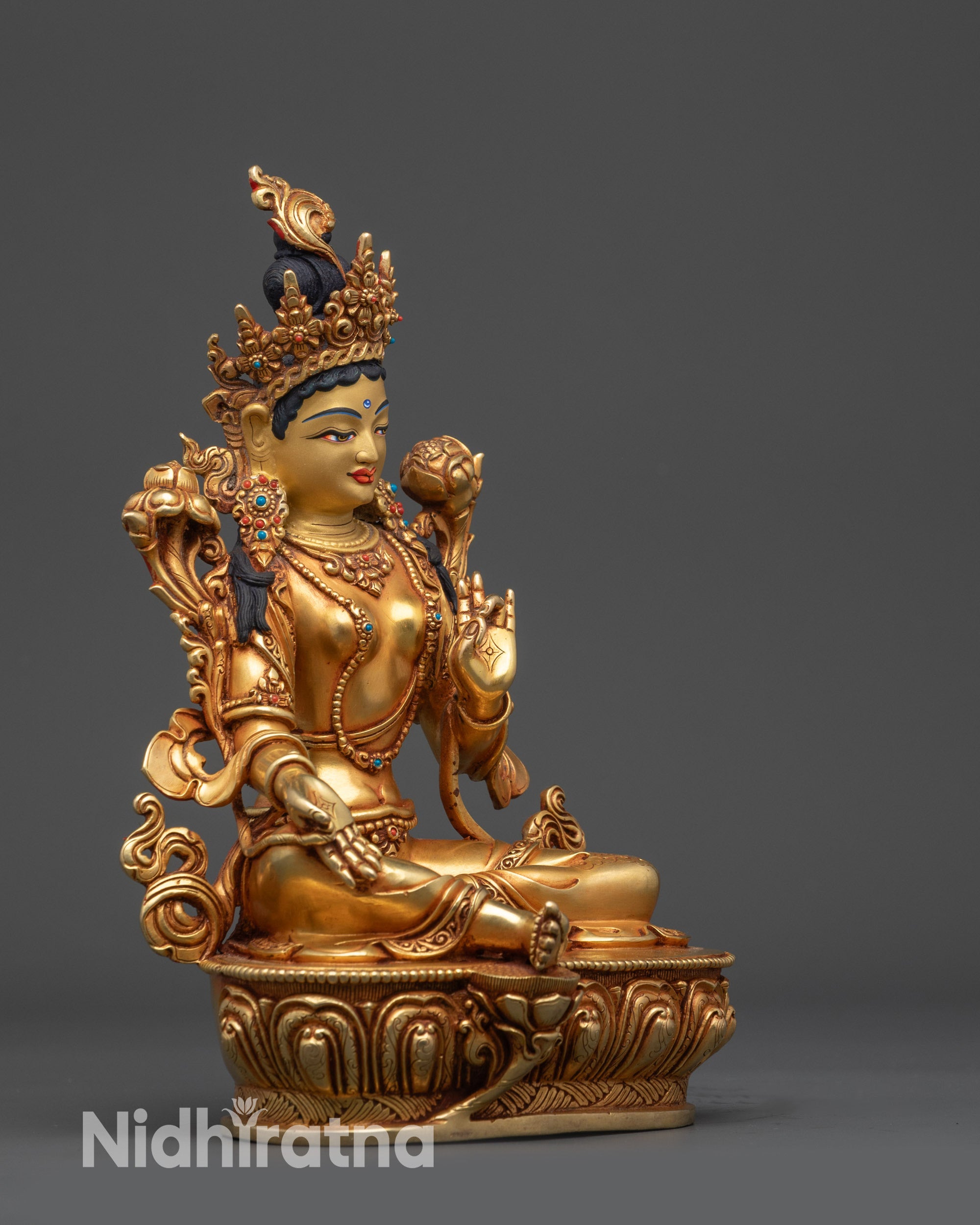 Green Tara Statue detailed close up face gold-gilded serene expression jeweled crown