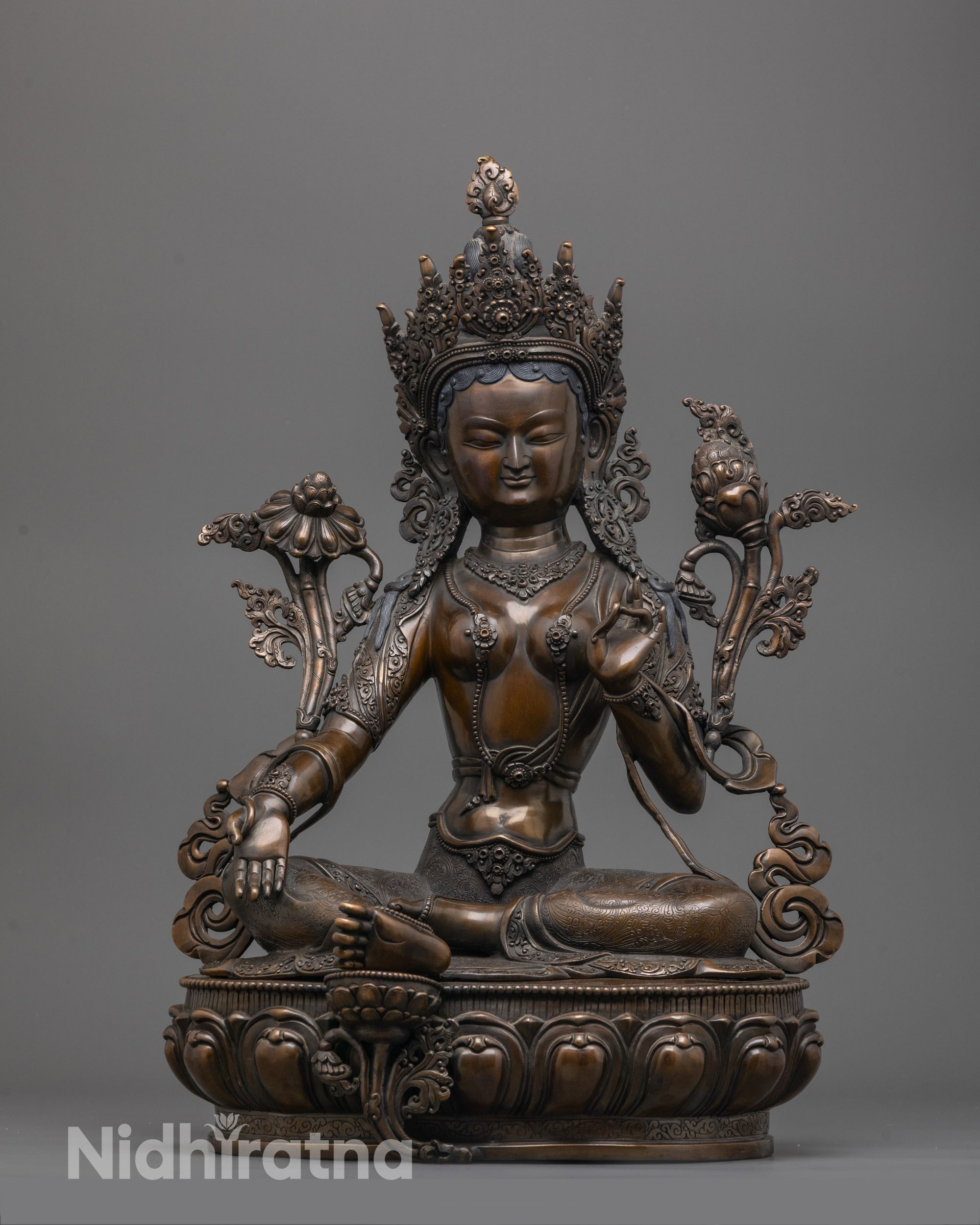Green Tara Statue front view in oxidized copper with hand-carved base and serene expression