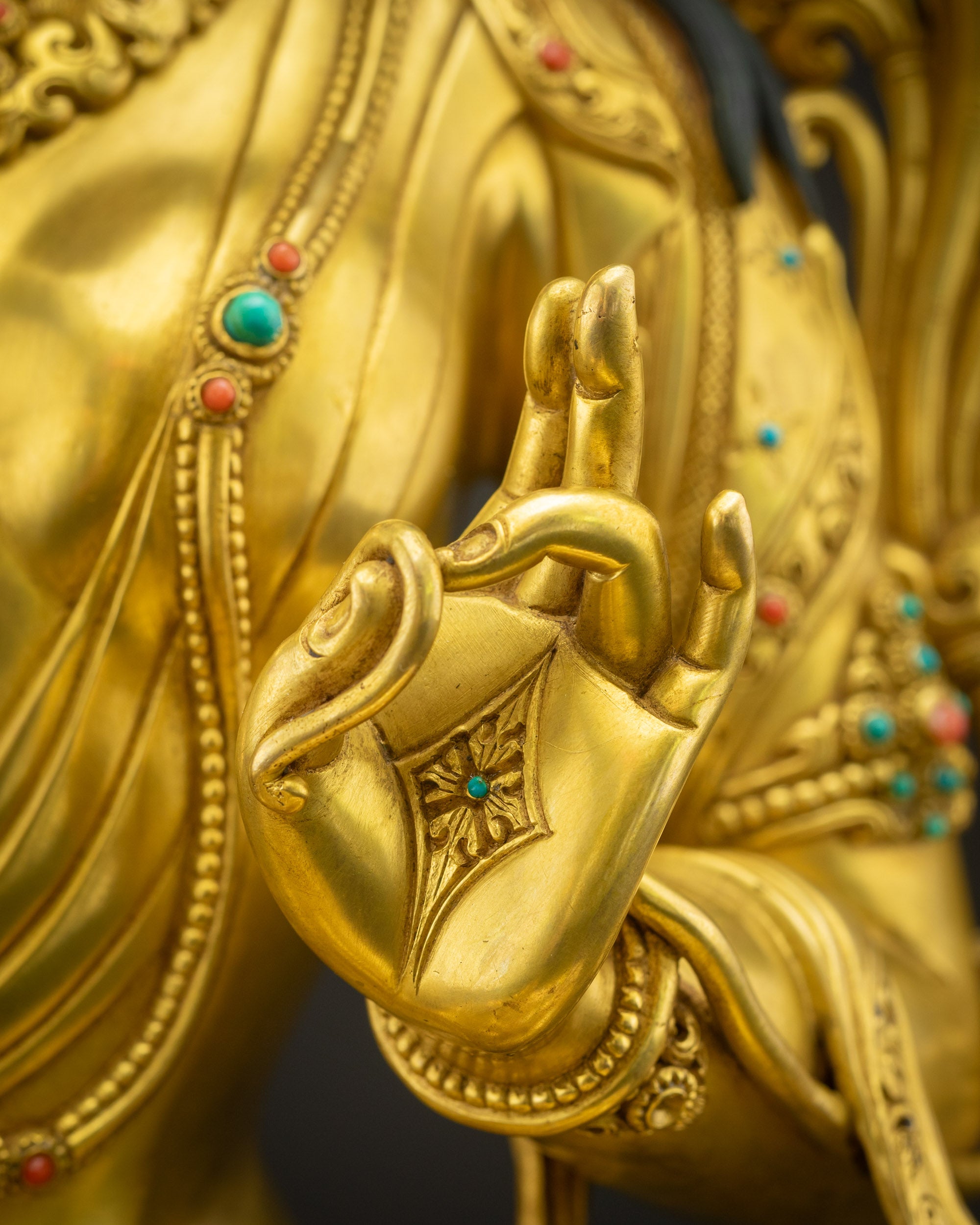 Green Tara holding utpala lotus with Abhaya Mudra, offering blessings