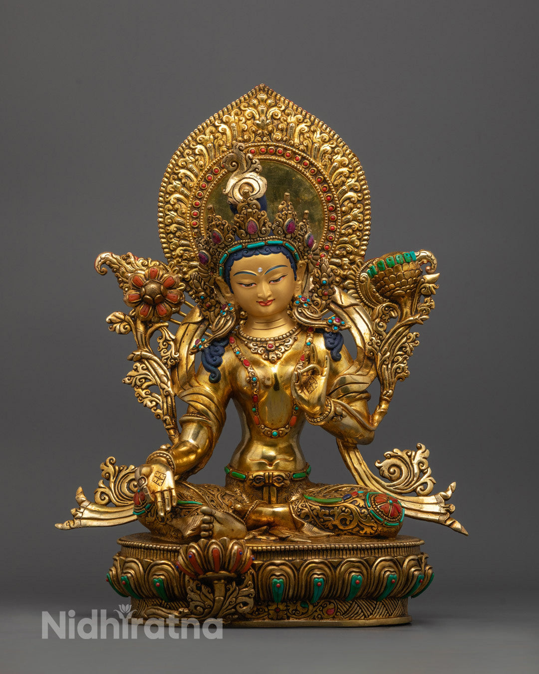 Green Tara Statue seated on lotus with varada mudra and semi-precious stone decoration